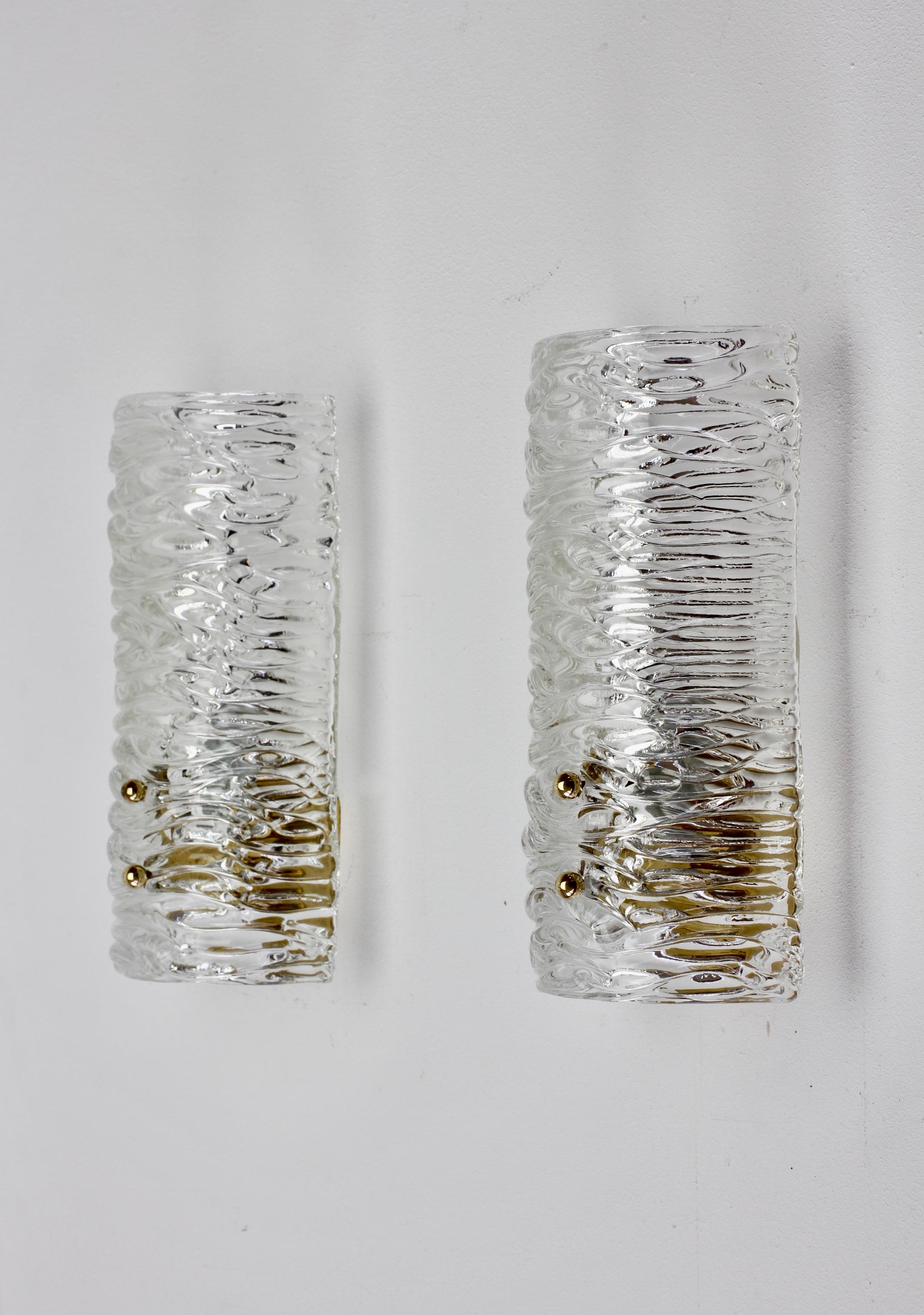 Pair of large elegant vintage midcentury Austrian made wall lights, lamps or sconces by J.T. Kalmar, circa 1955-1965. Featuring wonderful large curved sheet of textured / structured glass (similar to the type of clear glass seen on Rupert Nikoll