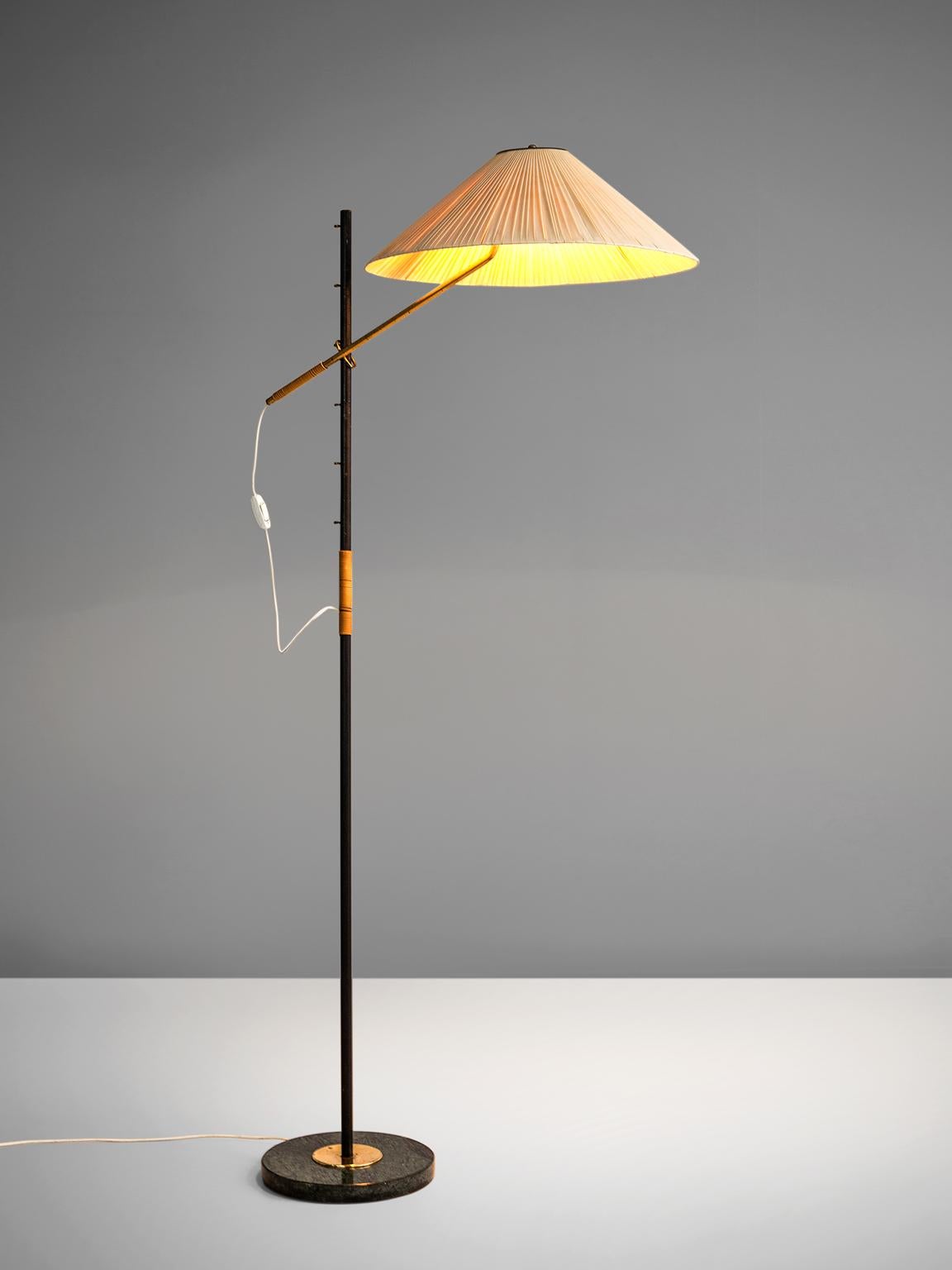 J.T. Kalmar, floor lamp 'Pelikan,' metal, fabric, green marble, brass, Austria, 1950s.

Slender floor lamp with green marble base. The shade is a traditional fabric shade with pleats. The metal stern is high and small and resembles a bird on one