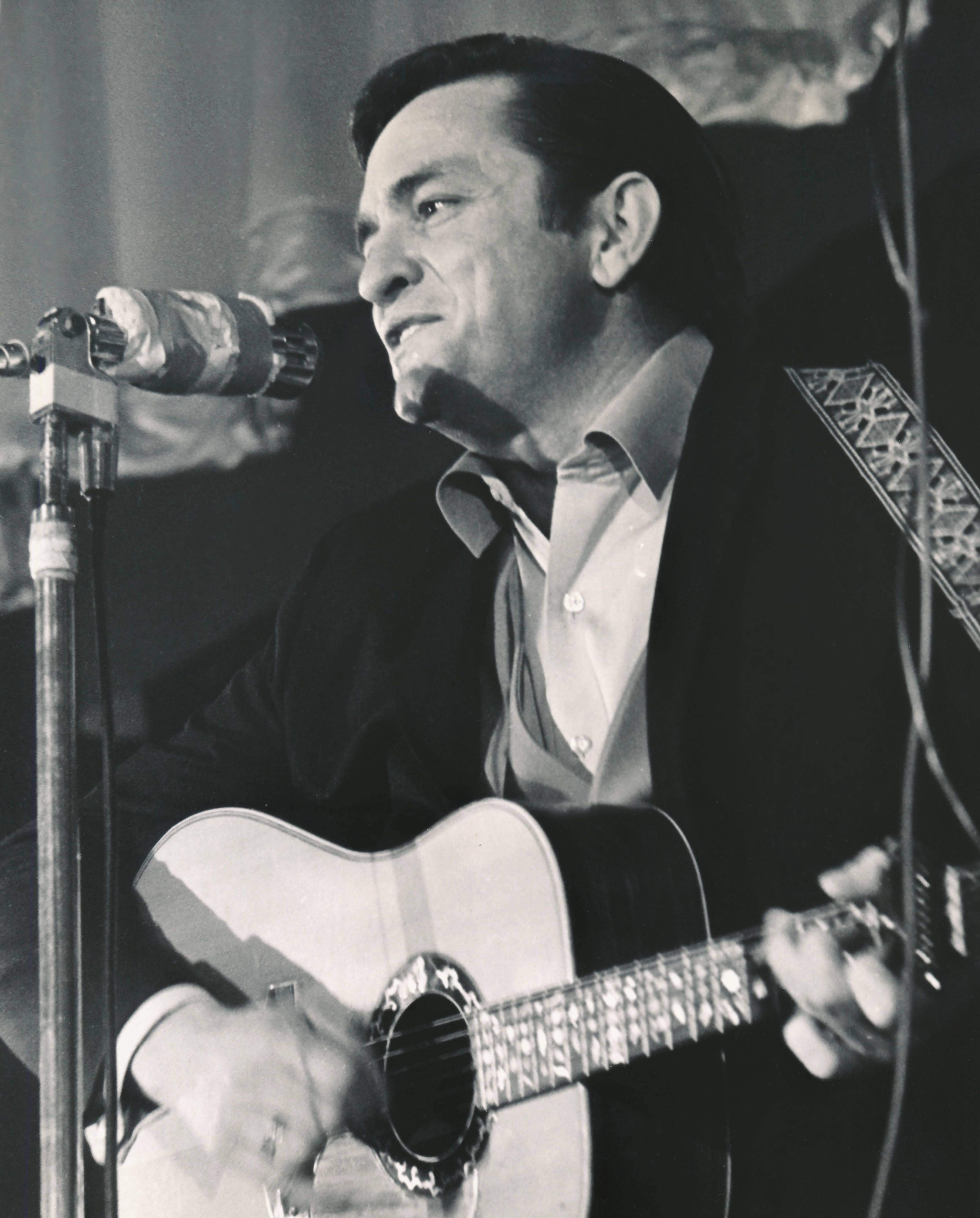 J.T. Phillips Black and White Photograph - Johnny Cash Performing on Stage Fine Art Print