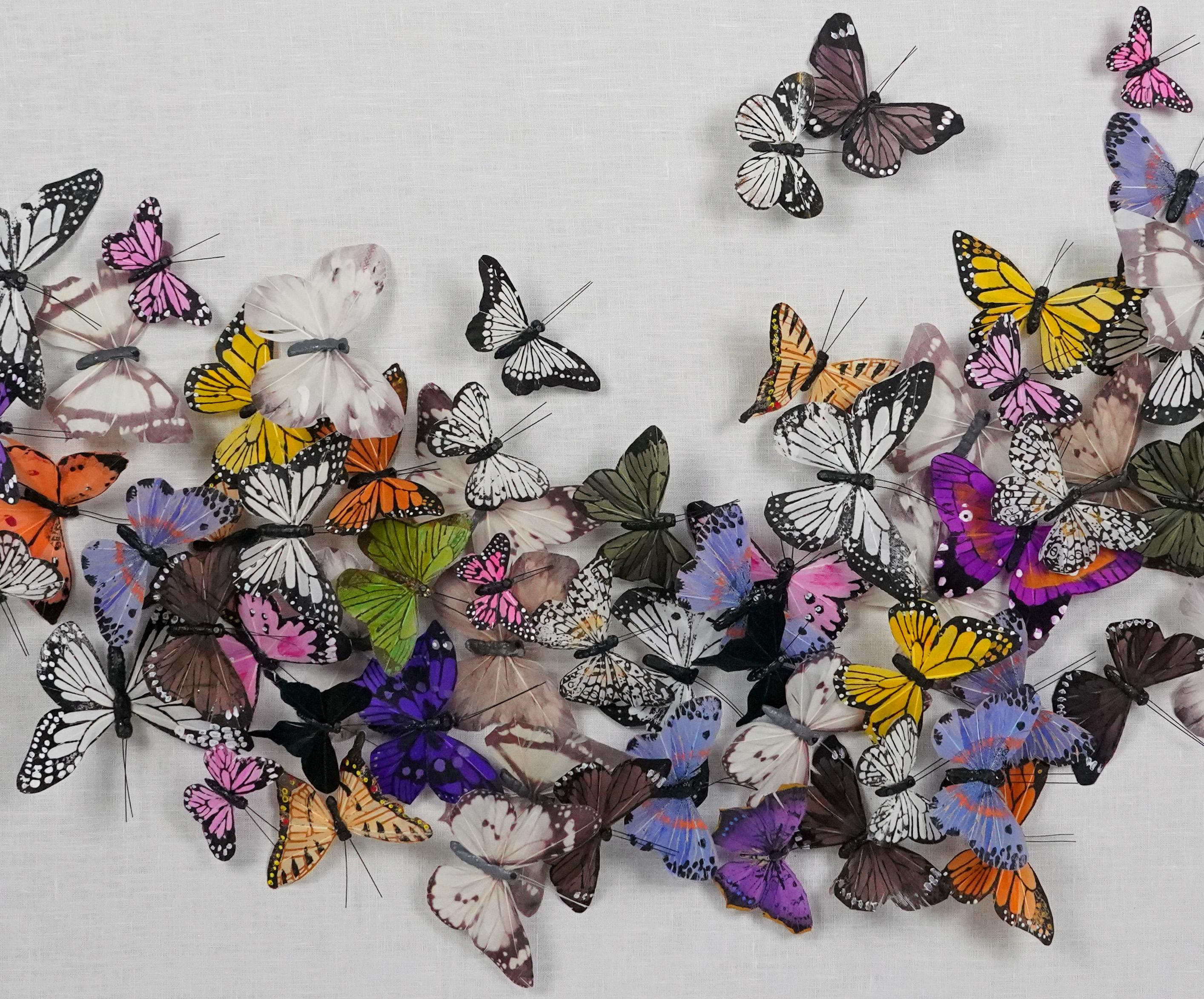 Juan Carlos Collada creates fantastical compositions filled with dozens of colorful, and perfectly symmetrical, butterflies. He constructs the butterflies with hand-painted silk and assembles them against a linen background. The butterflies flock