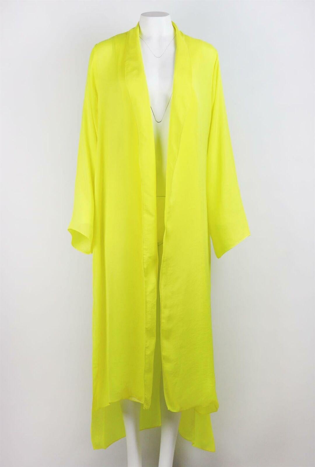 Juan Carlos Obando's fluid designs drape over the body in the most flattering way, cut from vibrant yellow and made from smooth satin, this long-line jacket has slits at the sides. Yellow satin. Slips on. 100% Viscose. 

Size: US 2 (UK 6, FR 34, IT