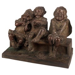 « Regarder quelque chose » : sculpture espagnole en bronze d'enfants sur banc de Juan Clara