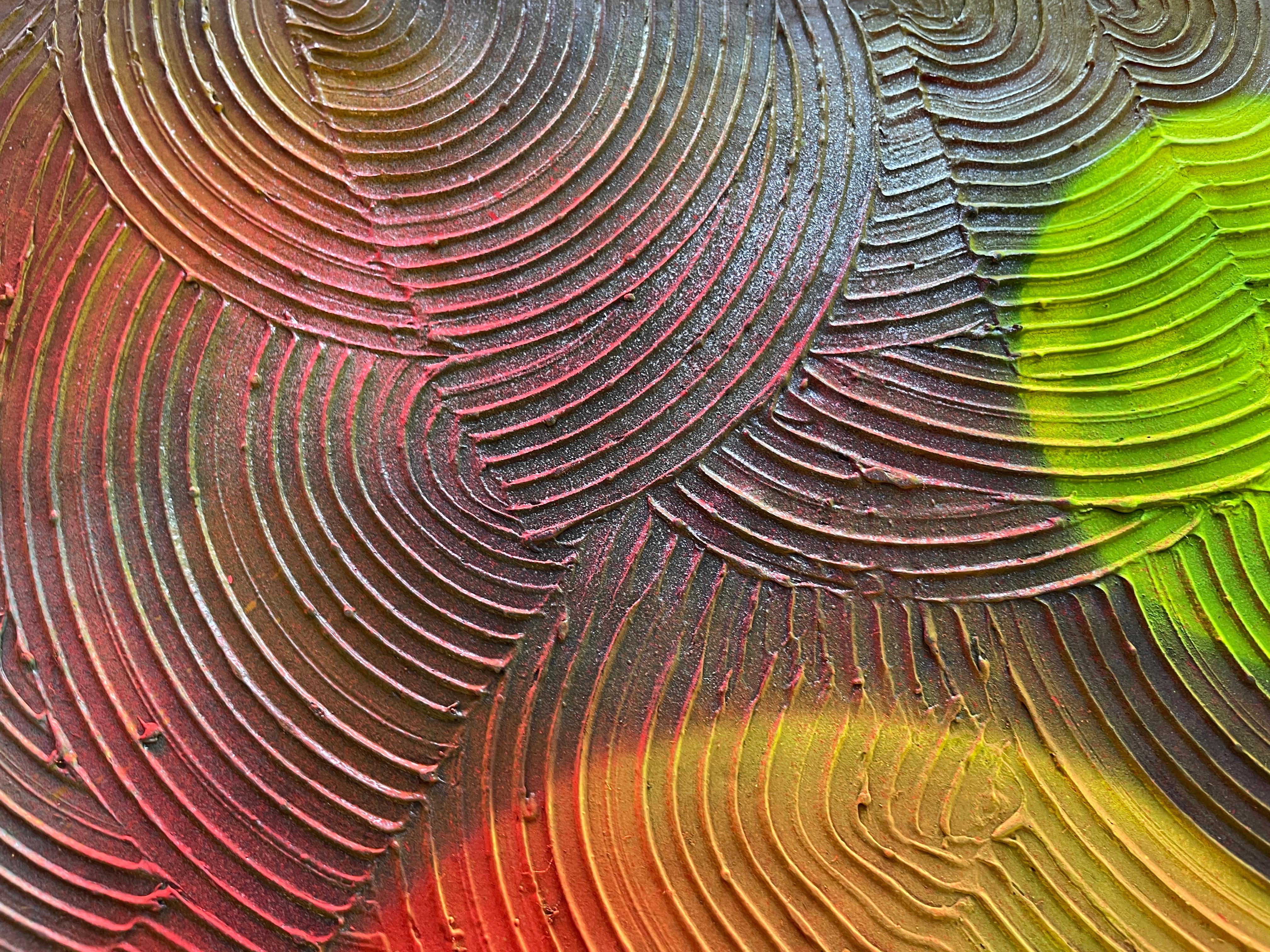 Abstract Transformation Circle 

This painting features an abstract artwork that combines resin techniques with circular relief on its surface. The resin, applied over the canvas, creates a smooth, glossy finish, while the relief in the form of