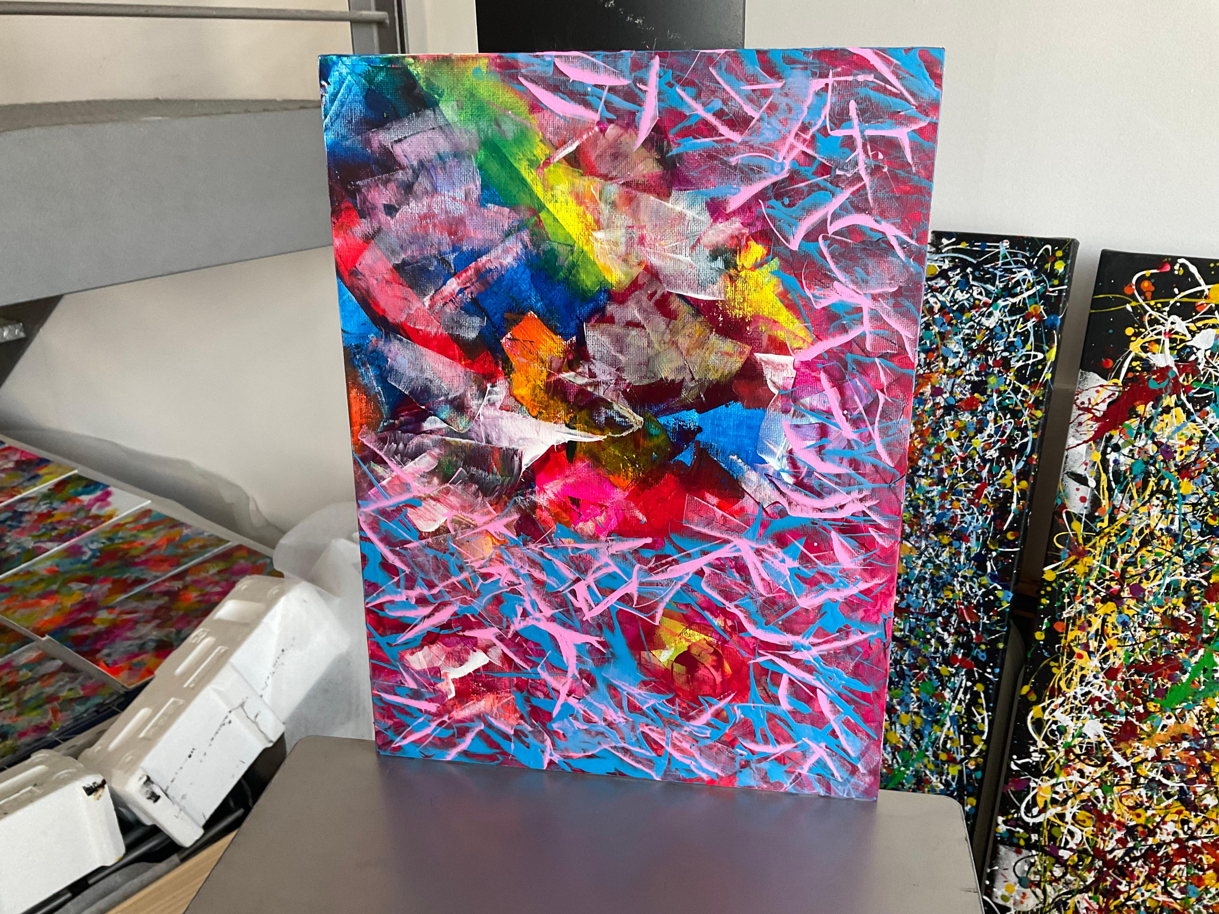 A painting in abstract acrylic is an explosion of shapes, textures, and colors that invite personal interpretation. Across the canvas, dynamic and free brushstrokes intertwine, creating layers of depth and movement. Vibrant tones, like intense reds