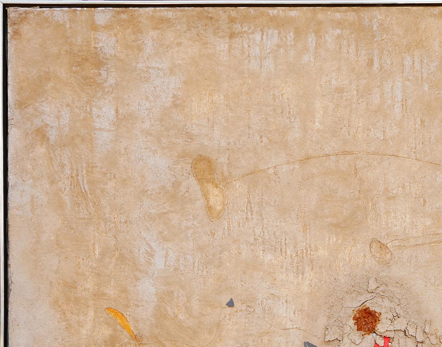 Modern abstract assemblage sculpture painting by Mexican-born artist Juan Sanchez-Juarez. The work features a tan, textured surface accented by a central pop of blue and orange that appear to be breaking through the canvas. Signed in the front lower