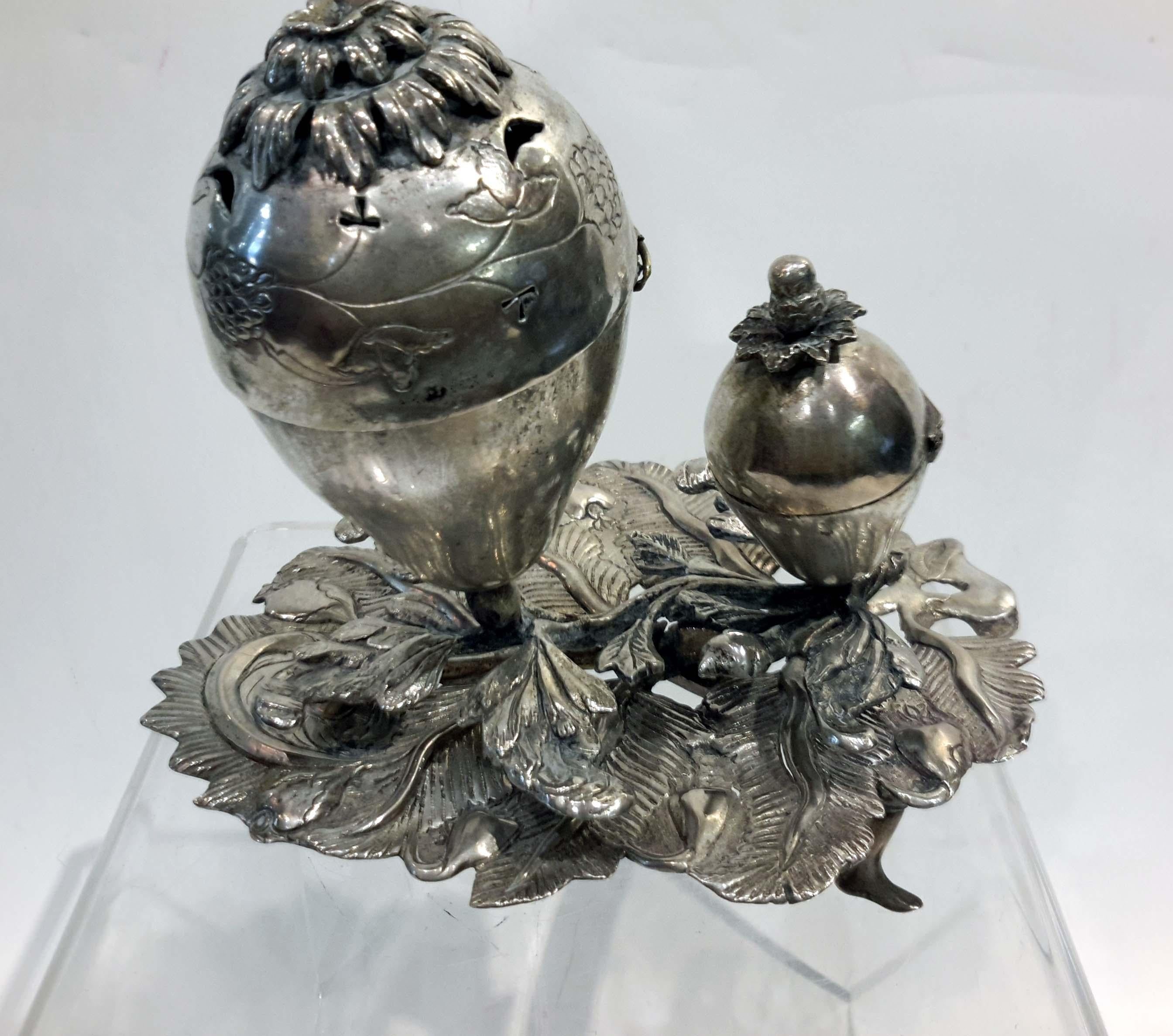 Judaic silver double spice container, Eastern Europe, 18th-19th century

Completely handmade/hammered. Has zigzag marks underneath, but no other touch marks could be found.

Missing finial from larger container. Small old restorations.

284