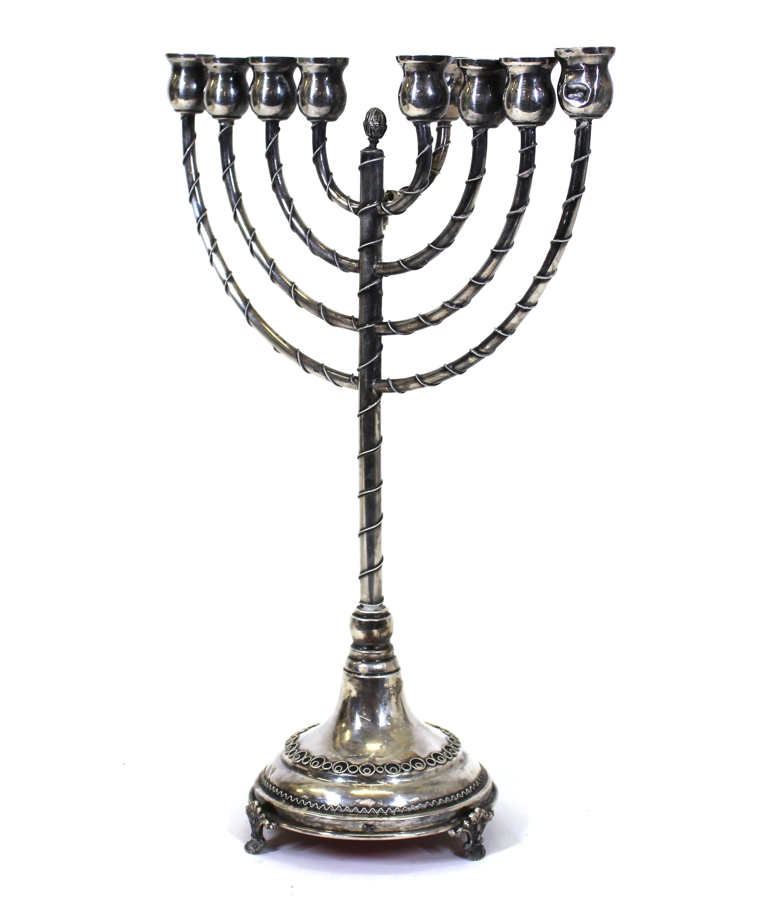 Judaica sterling silver Chanukah menorah, with mark on the foot. In remarkable antique condition with age-appropriate wear.