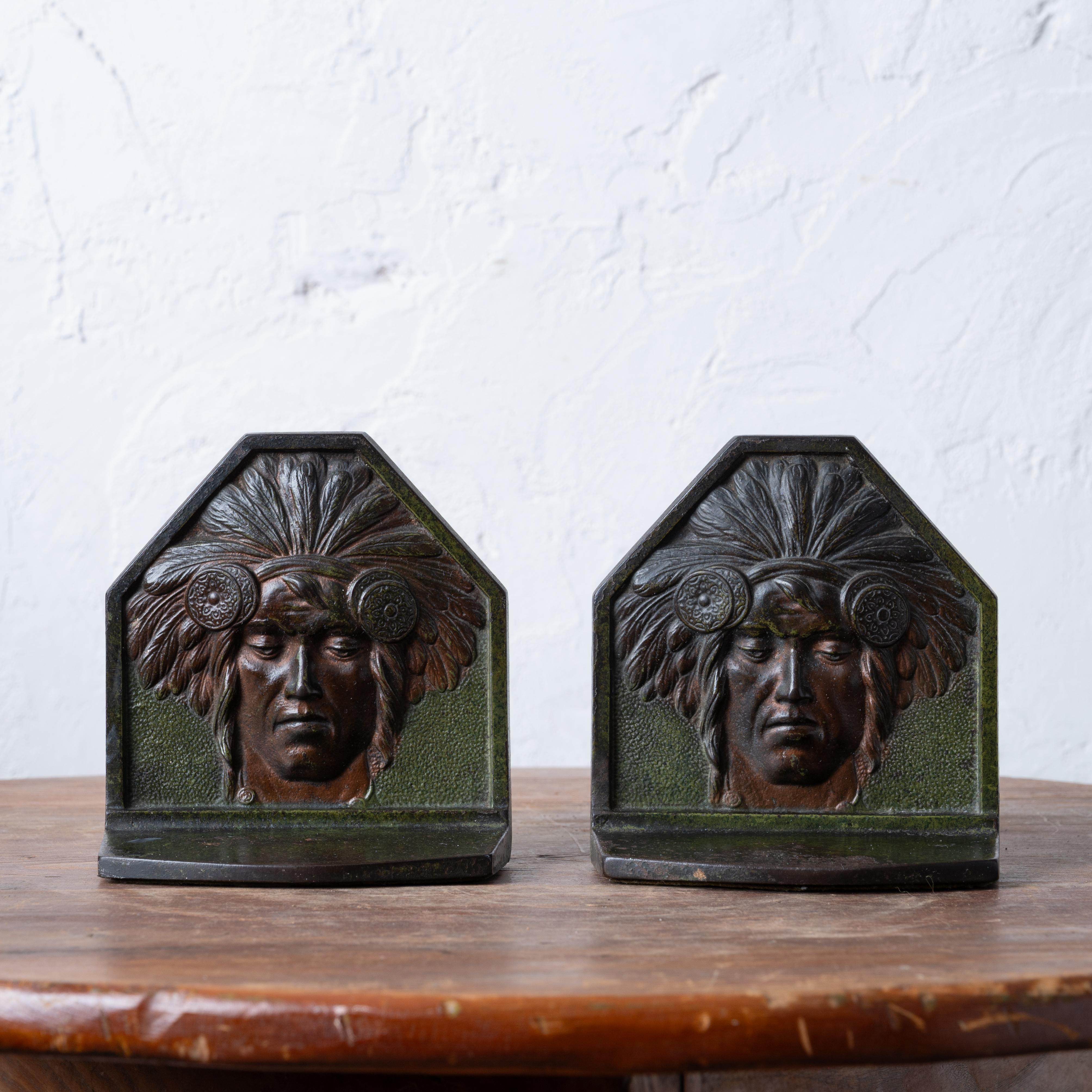 A pair of Judd bronze native american art deco bookends, 1920s.

5 inches wide by 2 ¾ inches deep by 5 ½ inches tall

