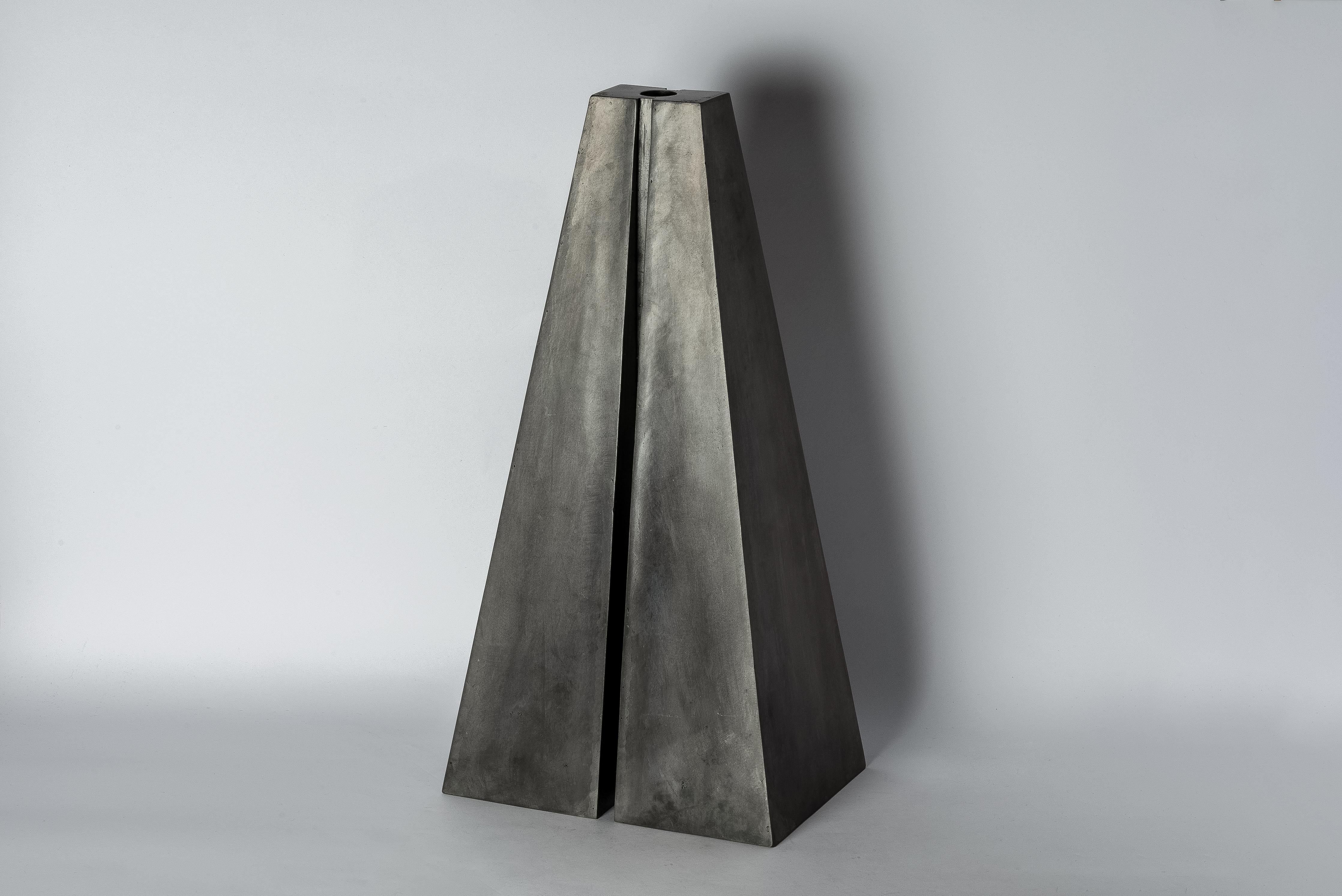 Candle Tower in iron with acid oxidation. This piece is 100% hand fabricated from metal plate; cut into sections and soldered together to make the hollow three dimensional form. It's more than just a candle holder; it's a captivating work of art