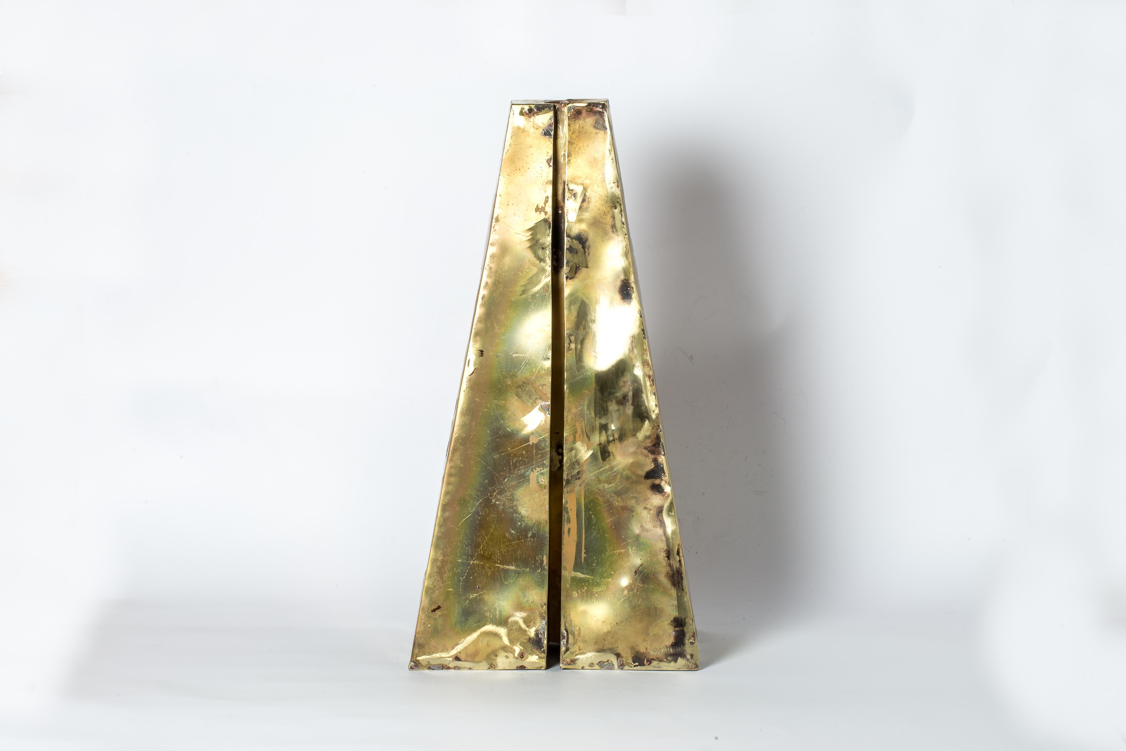 Candle Tower in brass. This piece is 100% hand fabricated from metal plate; cut into sections and soldered together to make the hollow three dimensional form. It's more than just a candle holder; it's a captivating work of art that exudes charm and