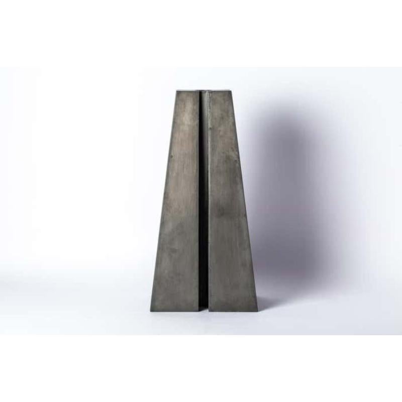 Candle Tower in iron. It showcases a stunning acid oxidation finish. It's more than just a candle holder; it's a captivating work of art that exudes charm and character.