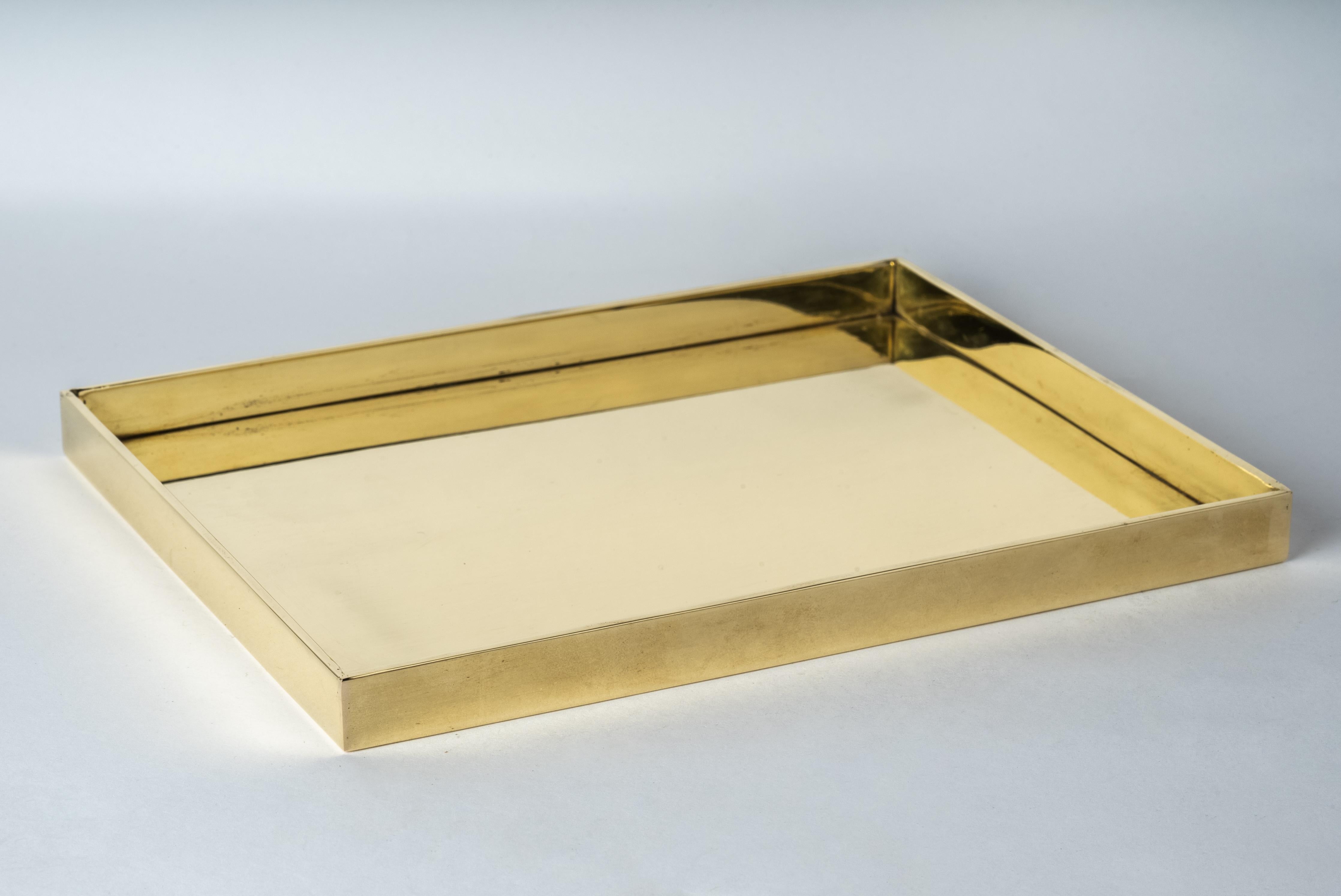 This tray is hand-made in polished brass. Crafted with meticulous care, it is a masterpiece of metalwork. Every inch is a testament to artisanal skill, with each section cut and shaped by hand.