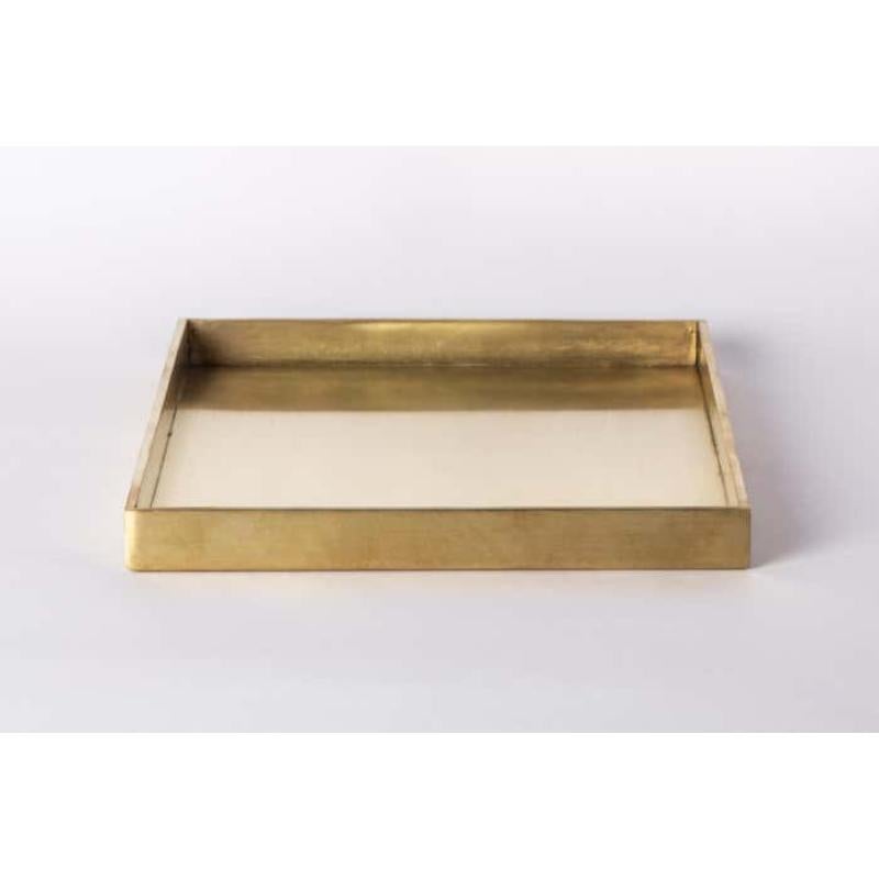 This tray is hand-made in brass. Crafted with meticulous care, it is a masterpiece of metalwork. Every inch is a testament to artisanal skill, with each section cut and shaped by hand.