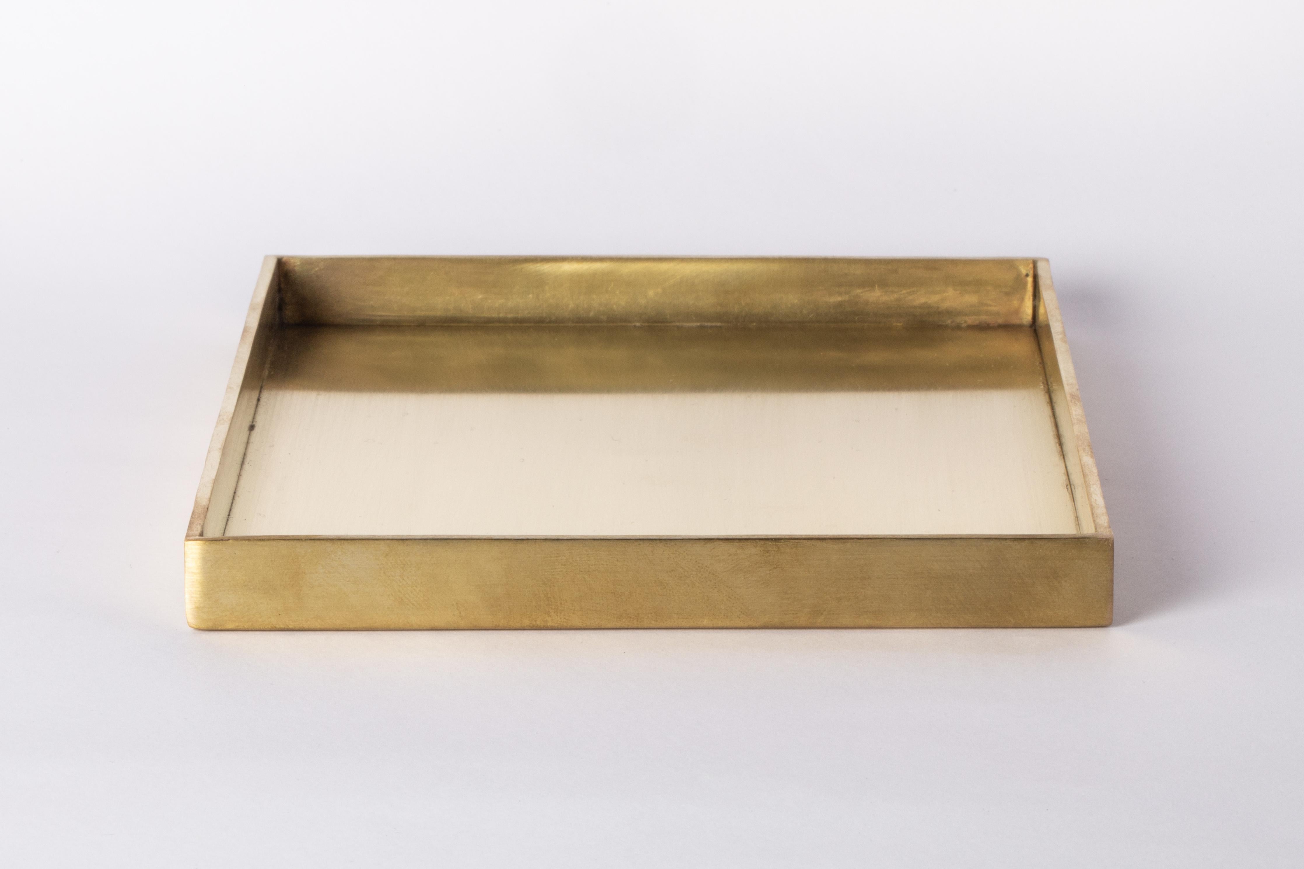 This tray is hand-made in brass. Crafted with meticulous care, it is a masterpiece of metalwork. Every inch is a testament to artisanal skill, with each section cut and shaped by hand.