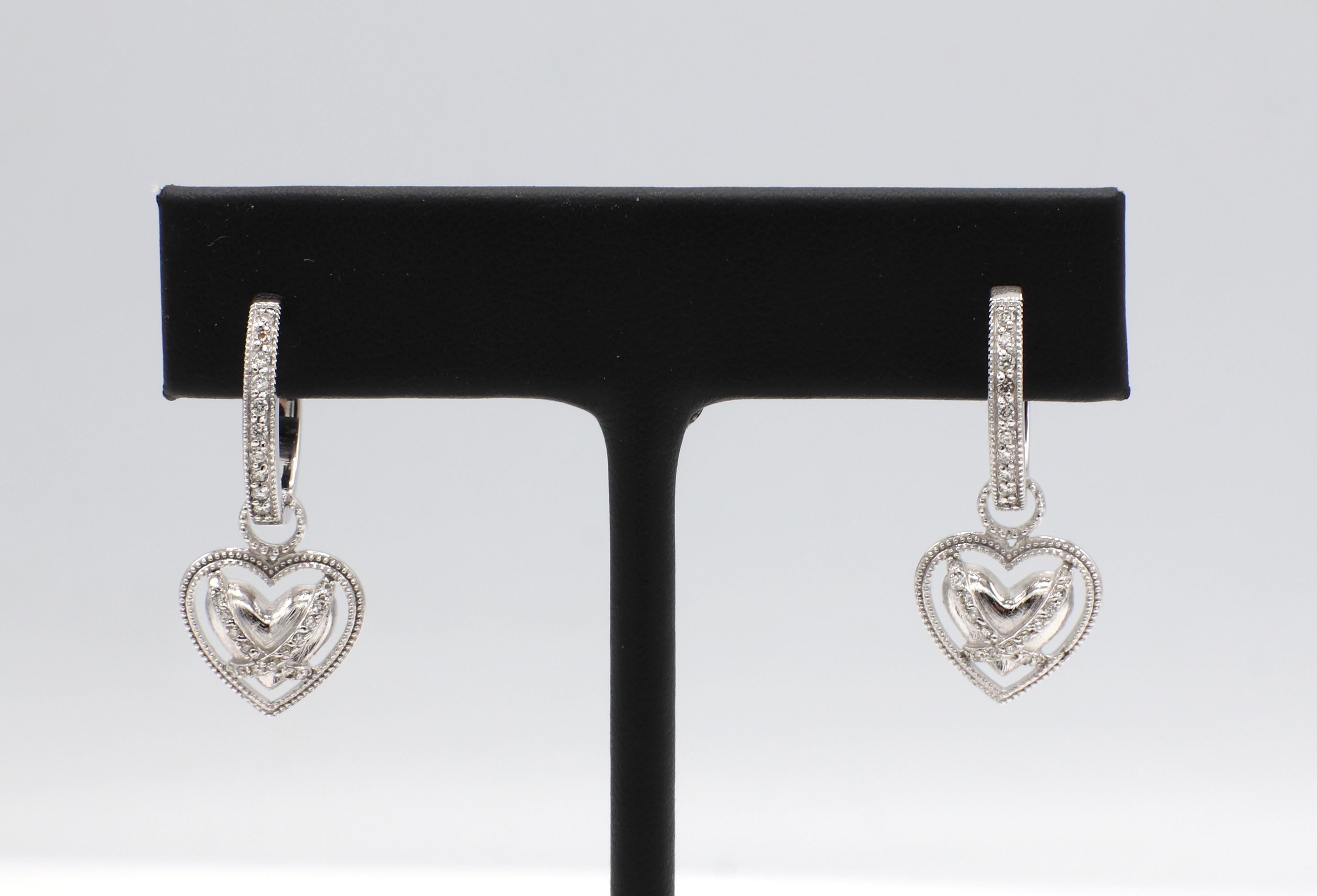 Jude Frances 18 Karat White Gold Hoop With Detachable Heart Charm Dangle Earrings 
Metal: 18k white gold
Weight: 8.21 grams
Diamonds: Approx. .25 CTW G VS natural diamonds
Hoops: 17mm diameter
Heart charm: 13 x 12mm (detachable)
Length: 27mm
Signed: