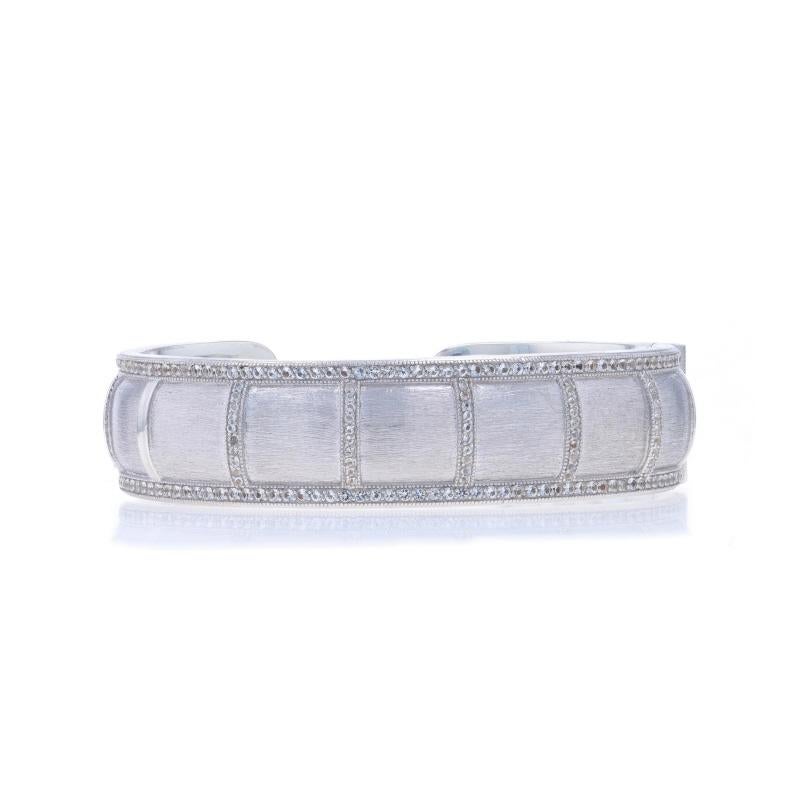 Brand: Jude Frances

Metal Content: Sterling Silver

Stone Information
Natural Topaz
Cut: Round
Color: White

Style: Hinged Cuff
Fastening Type: N/A (hinged, slides over wrist)
Features: Smooth & Brushed Finishes with Milgrain