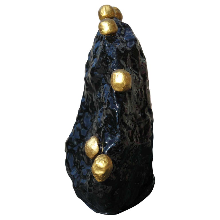 Black decorative sculpture with gold accents by Houston, TX contemporary artist Jude Rosemond. Sculpture is made from concrete, clay, stone with rosewater as the liquid base. This sculpture is a great, fun and classy addition to a modern