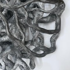 EMBRANGLE, gray monochrome circular ceramic wall sculpture relief
