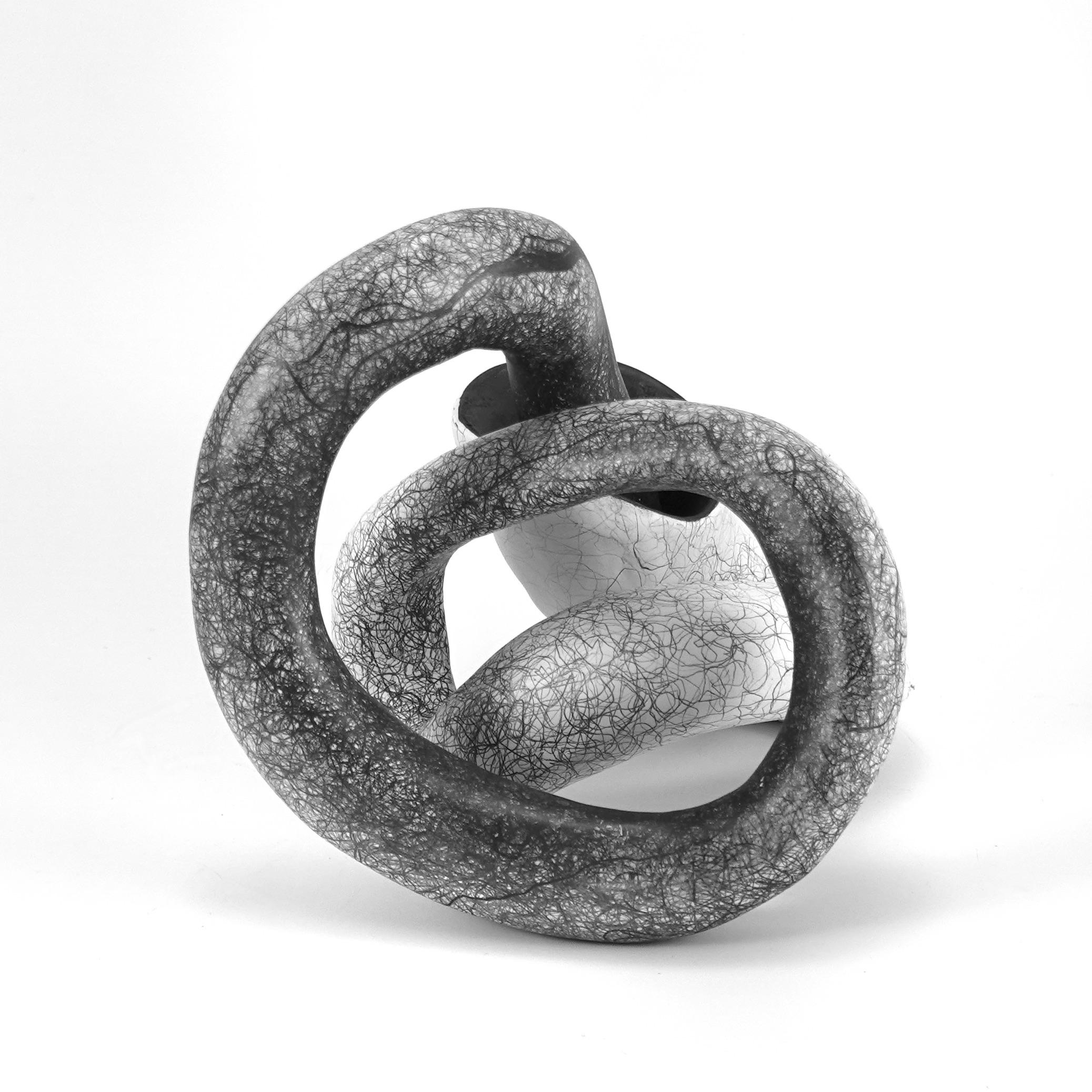 My biomorphic abstractions range from intimate to immersive in scale, referencing our interconnectedness. 
 Building curvilinear ceramic sculpture and then drawing intertwined graphite lines on the surface, creates energy that seems to emanate from
