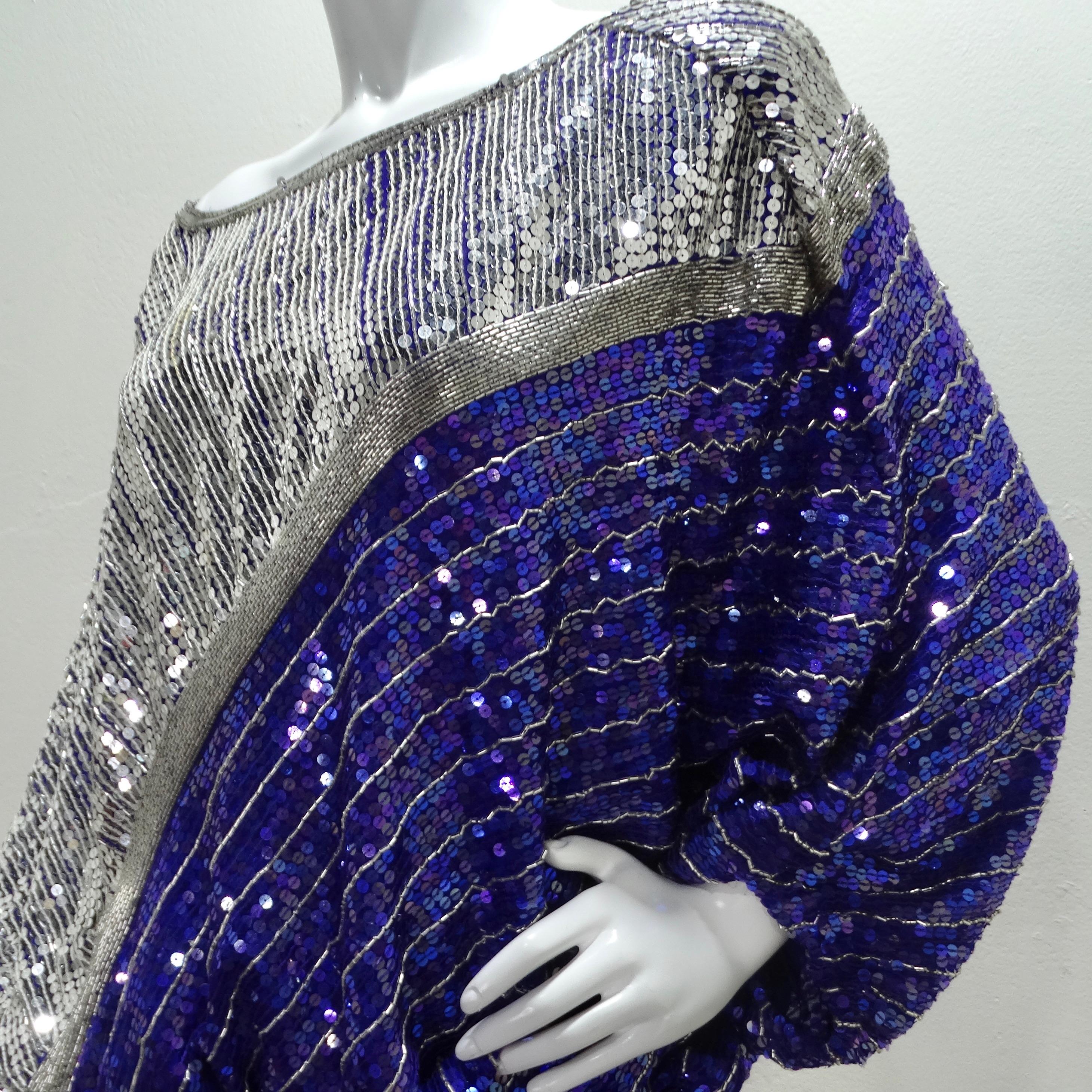 Make a dazzling entrance with the Judith Ann 1980s Purple Sequin Kaftan Dress – a show-stopping cocktail dress that epitomizes the bold and glamorous spirit of the 80s. This unique kaftan-style dress boasts a drop waist, a removable purple