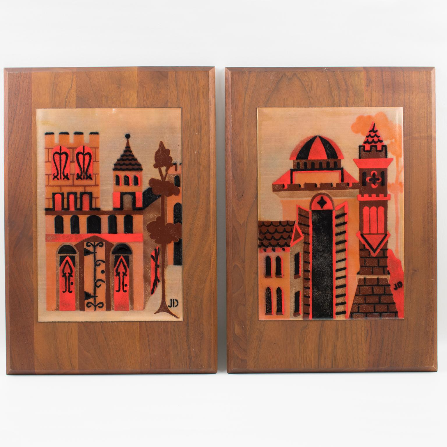 Judith Daner a conçu cette paire de superbes œuvres d'art en émail sur cuivre de style moderniste du milieu du siècle. Chaque panneau est une plaque d'un carreau montée sur le cadre original en bois de noyer. Le design abstrait et stylisé présente