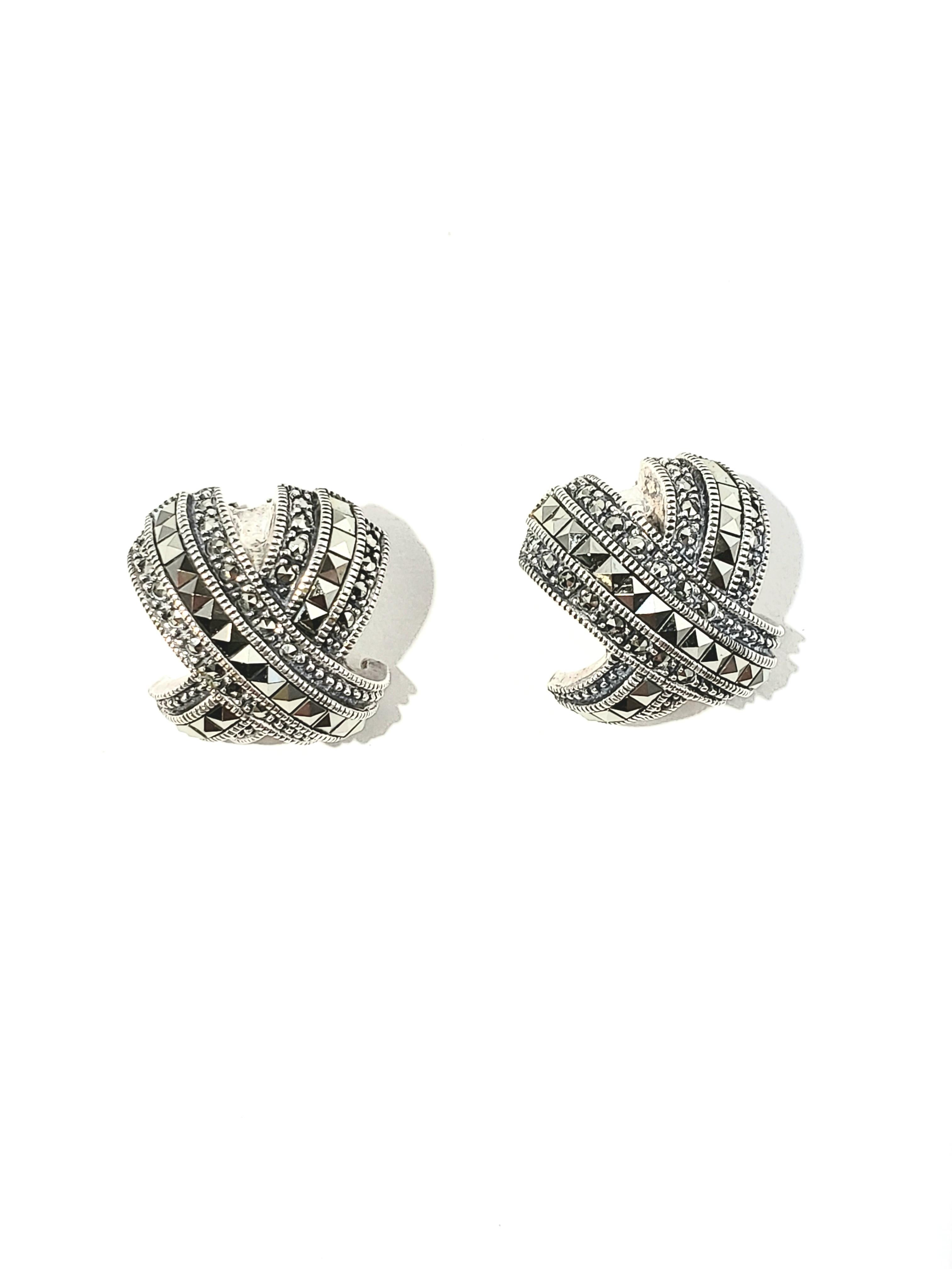 Judith Jack Marcasite Sterling Silver Criss Cross Earrings

This is an elegant pair of curved criss-cross design earrings with marcasite accent stones crafted by Judith Jack in Sterling Silver.

Measurements:     Measures 19mm L x 19mm W.  Measures