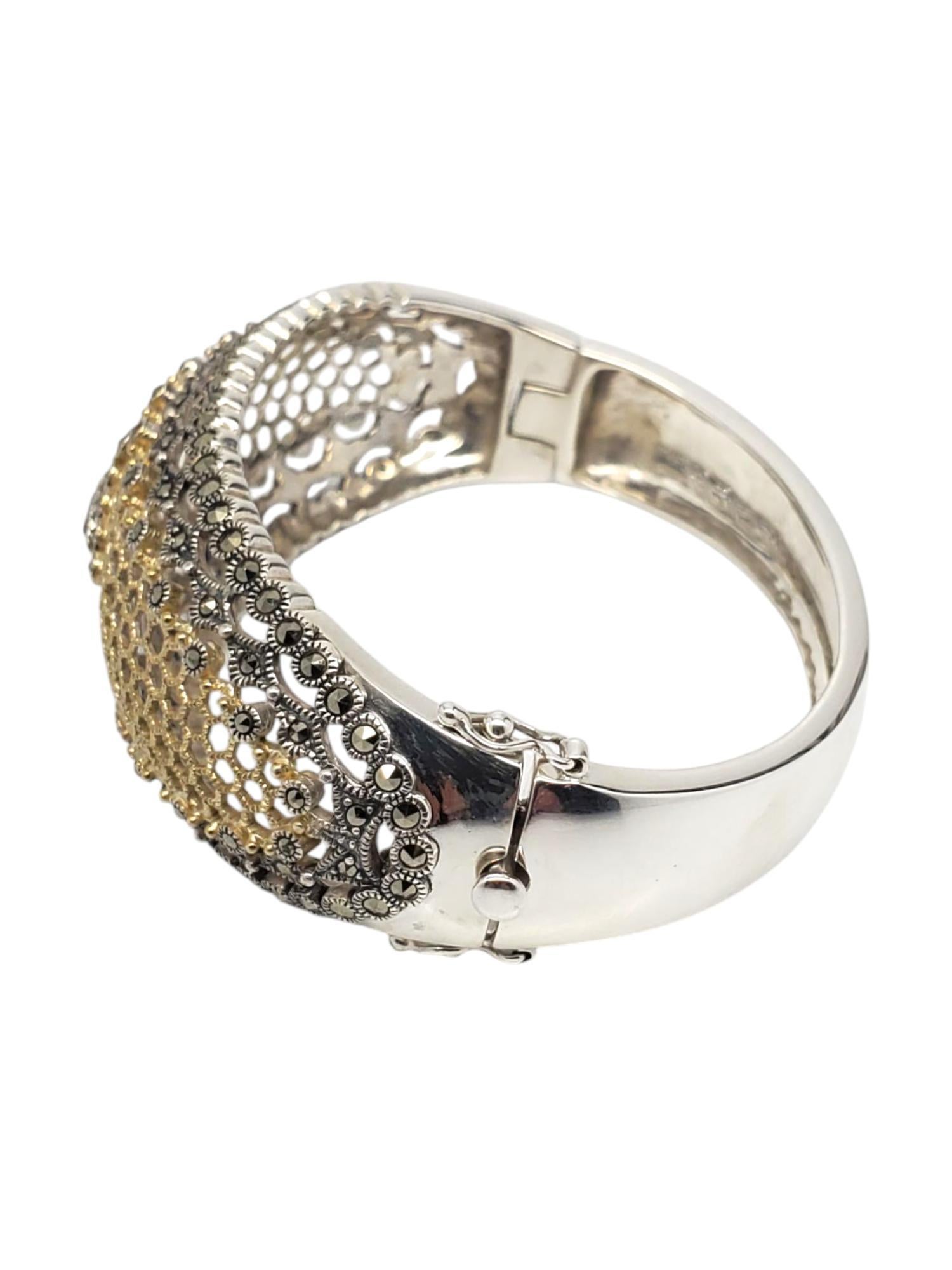 Judith Jack Sterling Silver& Gold-Tone Marcasite Bangle Bracelet 

This vintage bangle hinged bracelet features a marquise center stone (3.6 mm x 7.5 mm) and accent stones set in a honeycomb gold-tone design with intricate metal work set in sterling