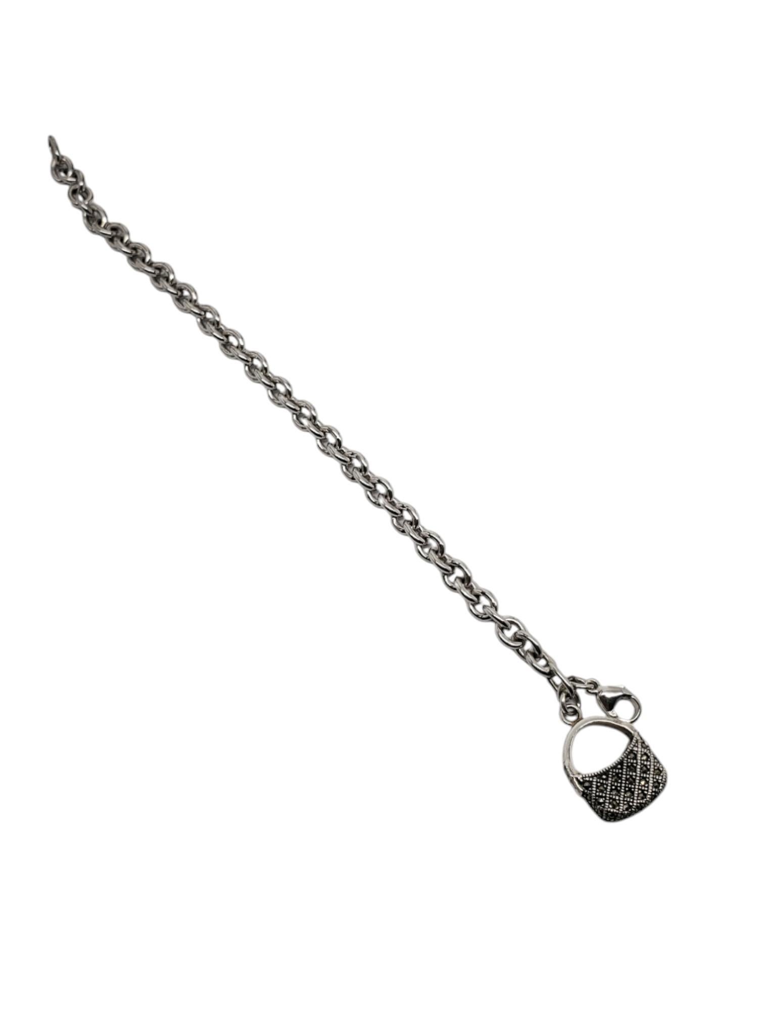 Judith Jack Sterling Silver Marcasite Purse Charm Bracelet -

This vintage charm bracelet by Judith Jack features a marcasite purse charm on a sterling silver rolo chain bracelet.

Size: 7 in.
Purse approx. 22mm x 15.5mm

Stamped: J J