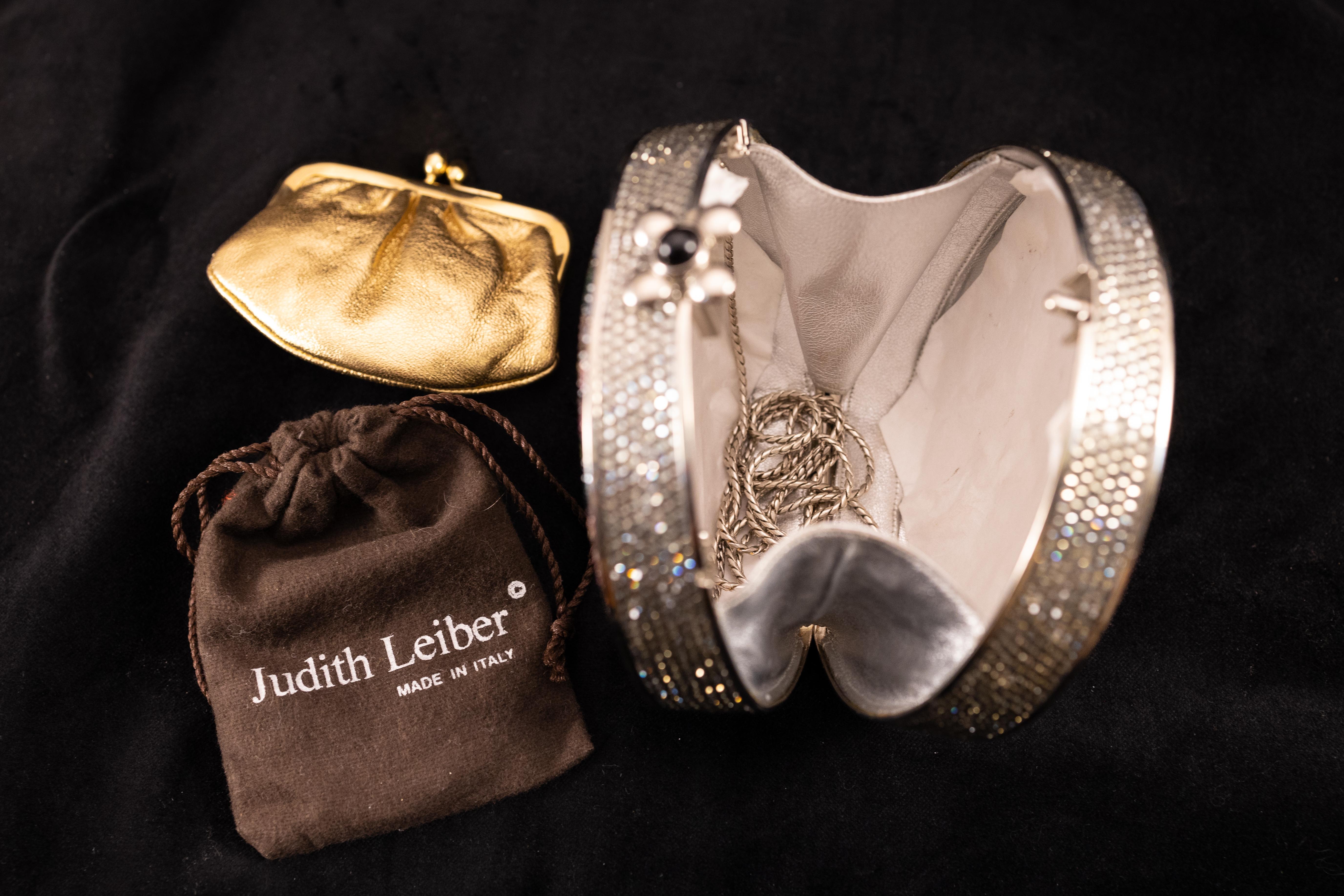 Striking Judith Leiber Vintage Swarovski Crystal Spider Web Canteen Minaudiere Evening Bag in excellent condition. Multicolor swarovski crystal exterior in a unique spider web pattern. Button closure opens to a silver leather interior.  Hidden