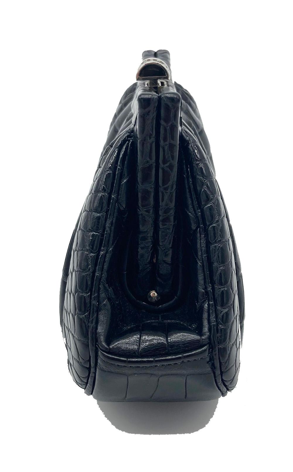 Judith Leiber Black Alligator Mini Evening Bag in excellent condition. Black alligator exterior trimmed with a crystal silver top button closure. Black silk interior with one slit side pocket and removable silver chain shoulder strap. no stains