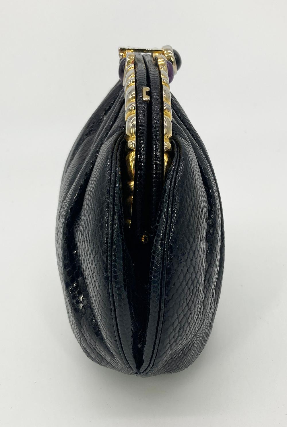 Judith Leiber Black Lizard Purple & Black Gemstone Top Clutch in good condition. Black lizard exterior trimmed with gold hardware and black and purple gemstones along top edge. Lift latch closure opens to a black silk interior with 2 side slit
