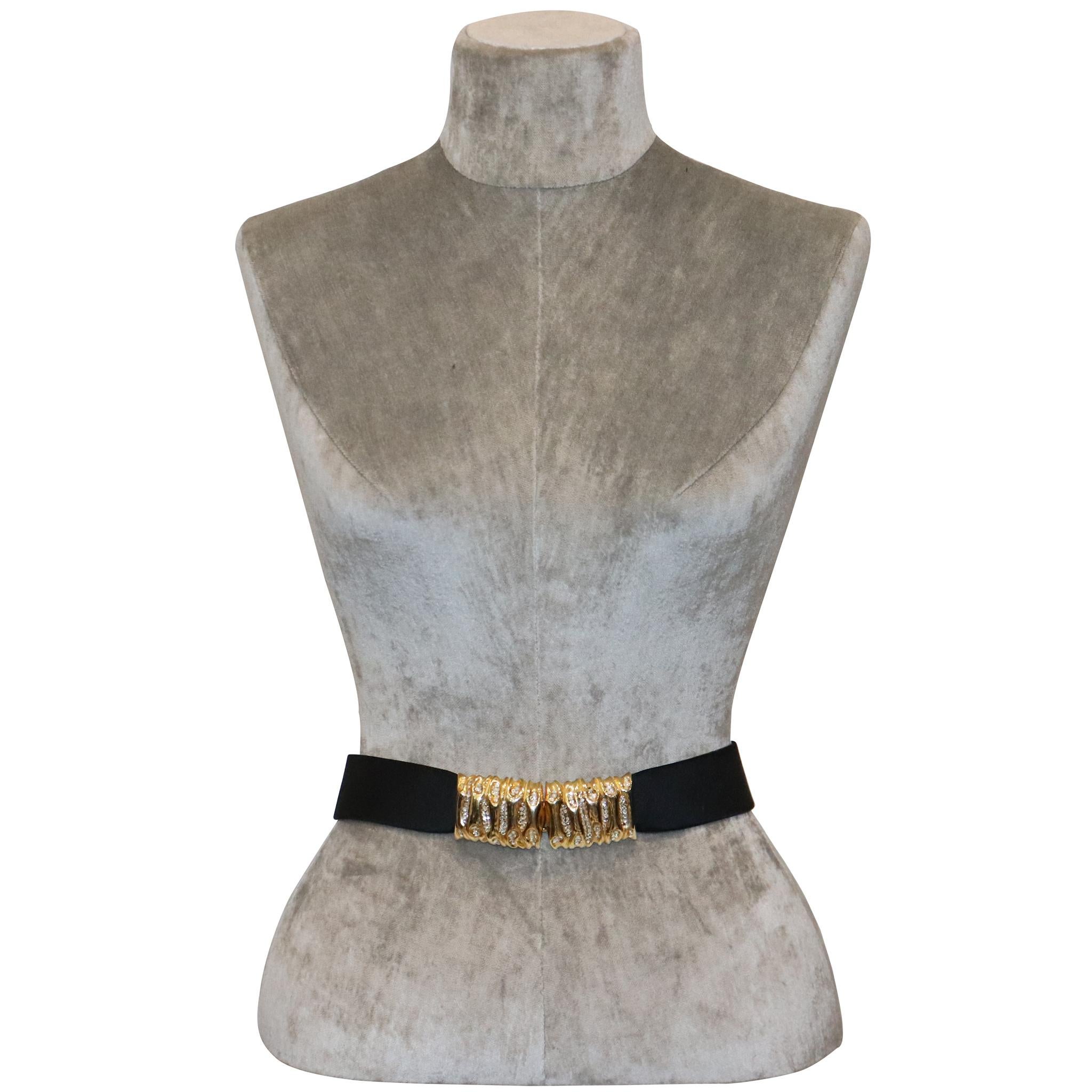 Judith Leiber Black Satin Belt W/ Rhinestone Accents. In excellent condition 

Measurements: 

Longest length - 33.1 inches 

Shortest length - 31 inches 

Height - 1.5 inches 
