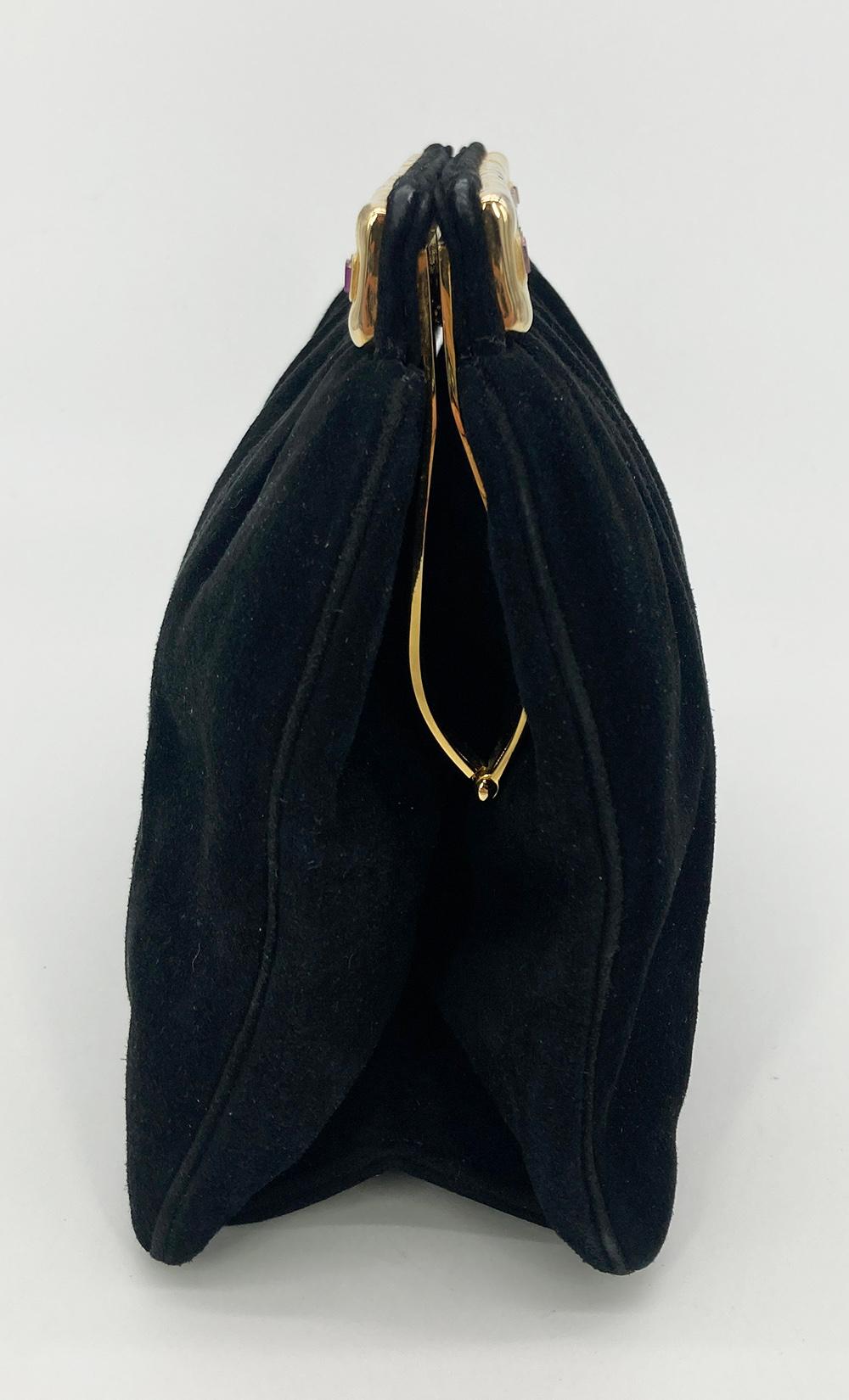 Judith Leiber Black Suede Gemstone Top Clutch in very good condition. black suede trimmed with gold hardware and multi color gemstones along top edge. Top side pull latch closure opens to a black nylon interior with one slit and one zip side pockets