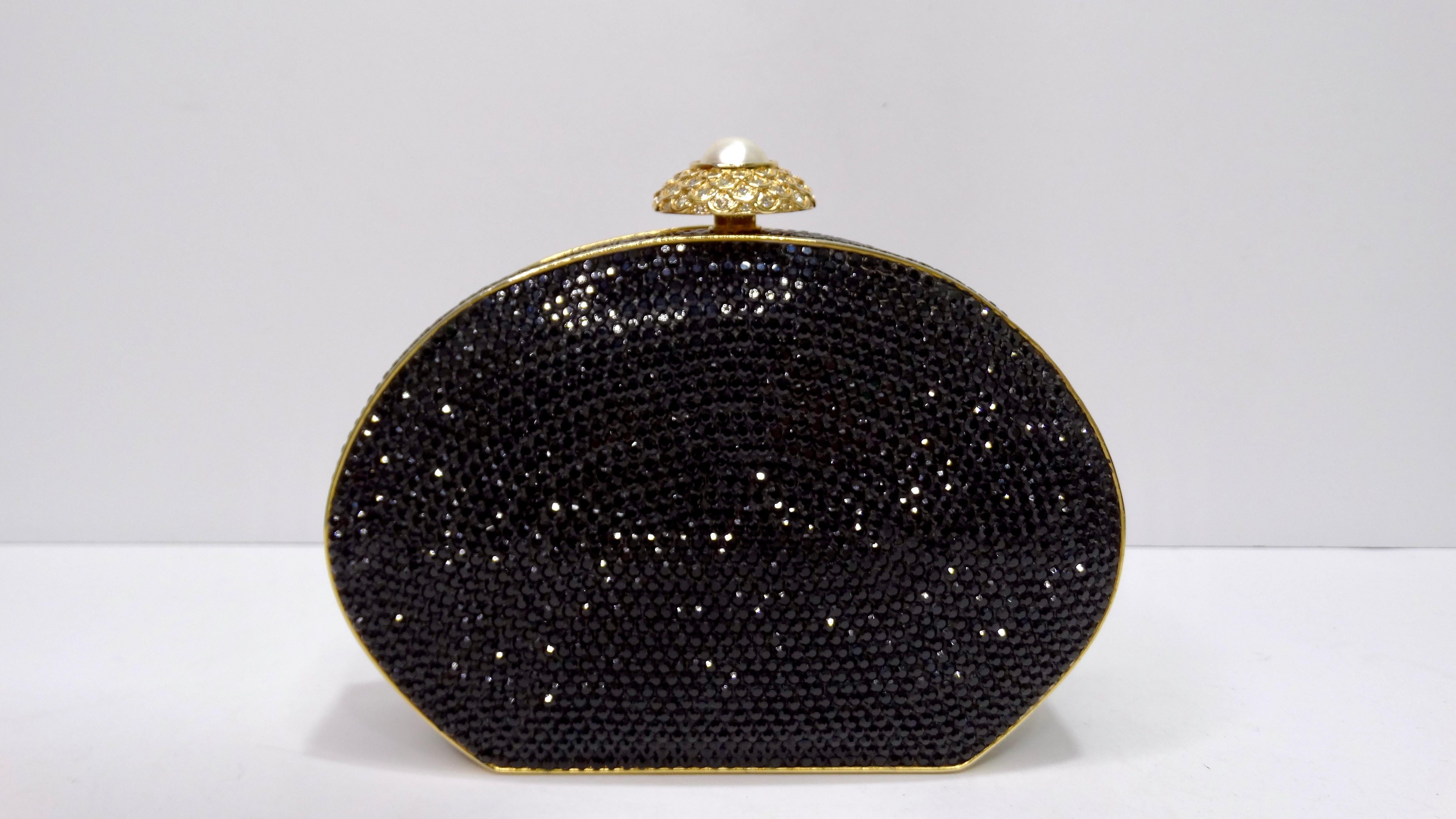Elegance and glamor right this way! This is a highly designed handbag that will catch people's attention from across the room. This is a BEAUTIFUL Judith Leiber Black Swarovski Crystal Minaudiere Evening Bag Clutch in excellent condition. The
