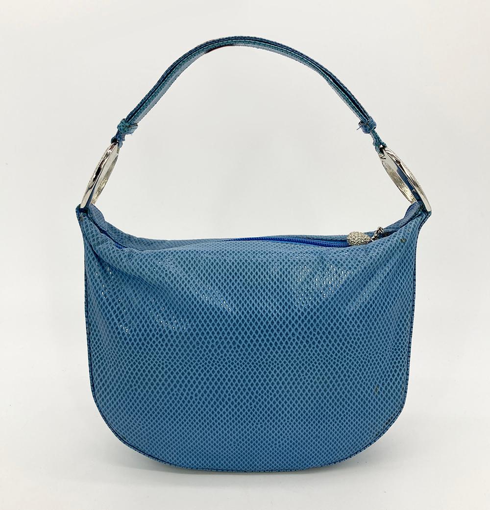 Judith Leiber Blue Lizard Crystal Accent Handbag in fair condition. Blue lizard exterior trimmed with silver hardware and swarovski crystals on each end of handle. Top crystal teardrop zip closure opens to a blue satin lining with one zip and one