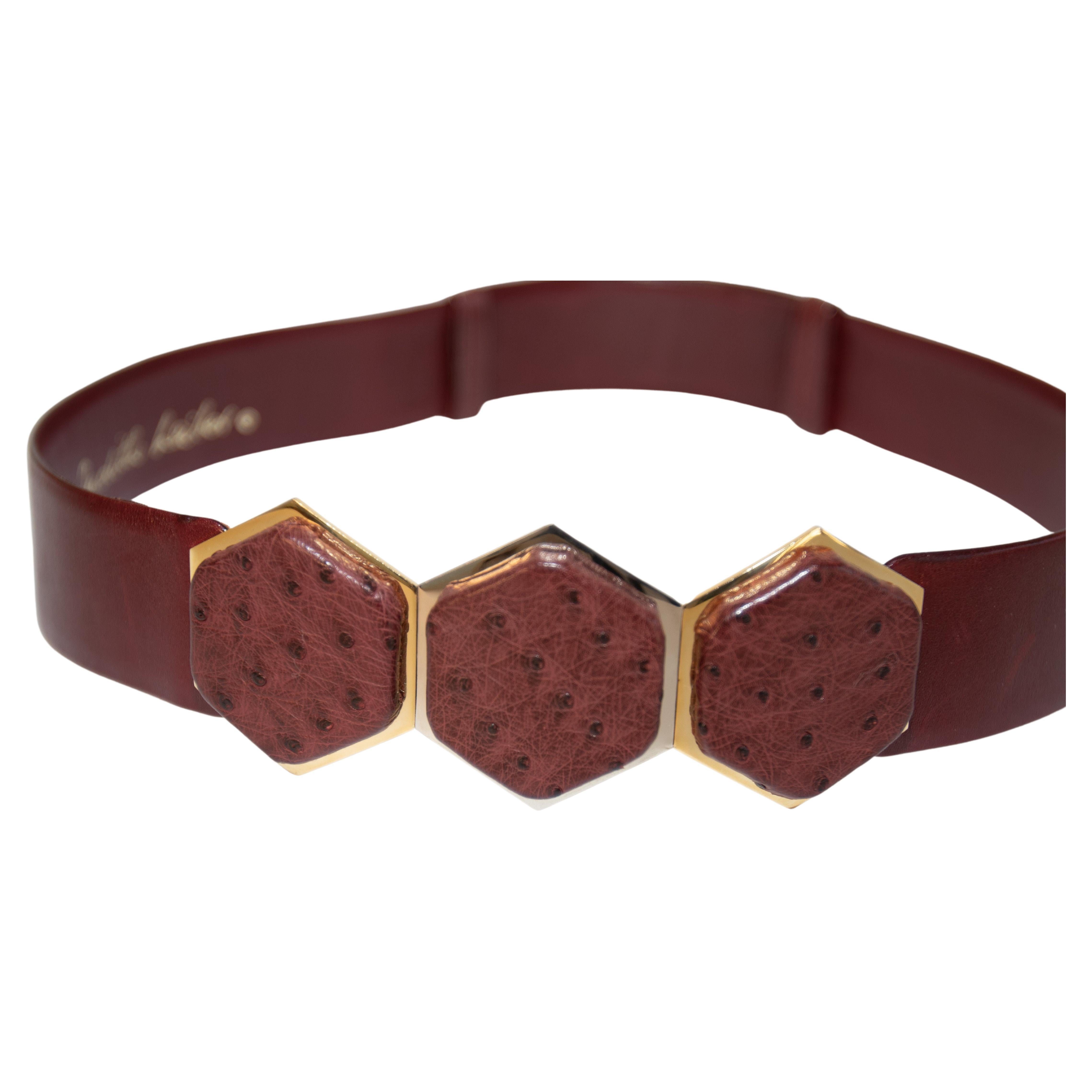 Judith Leiber brown leather belt 1980's with gold and silver tone buckle with a three large octagonal Art Deco clasp with Ostrich style leather covered cabochon.
Beautiful vintage 1980’s Judith Leiber brown maroon leather belt that has a sliding