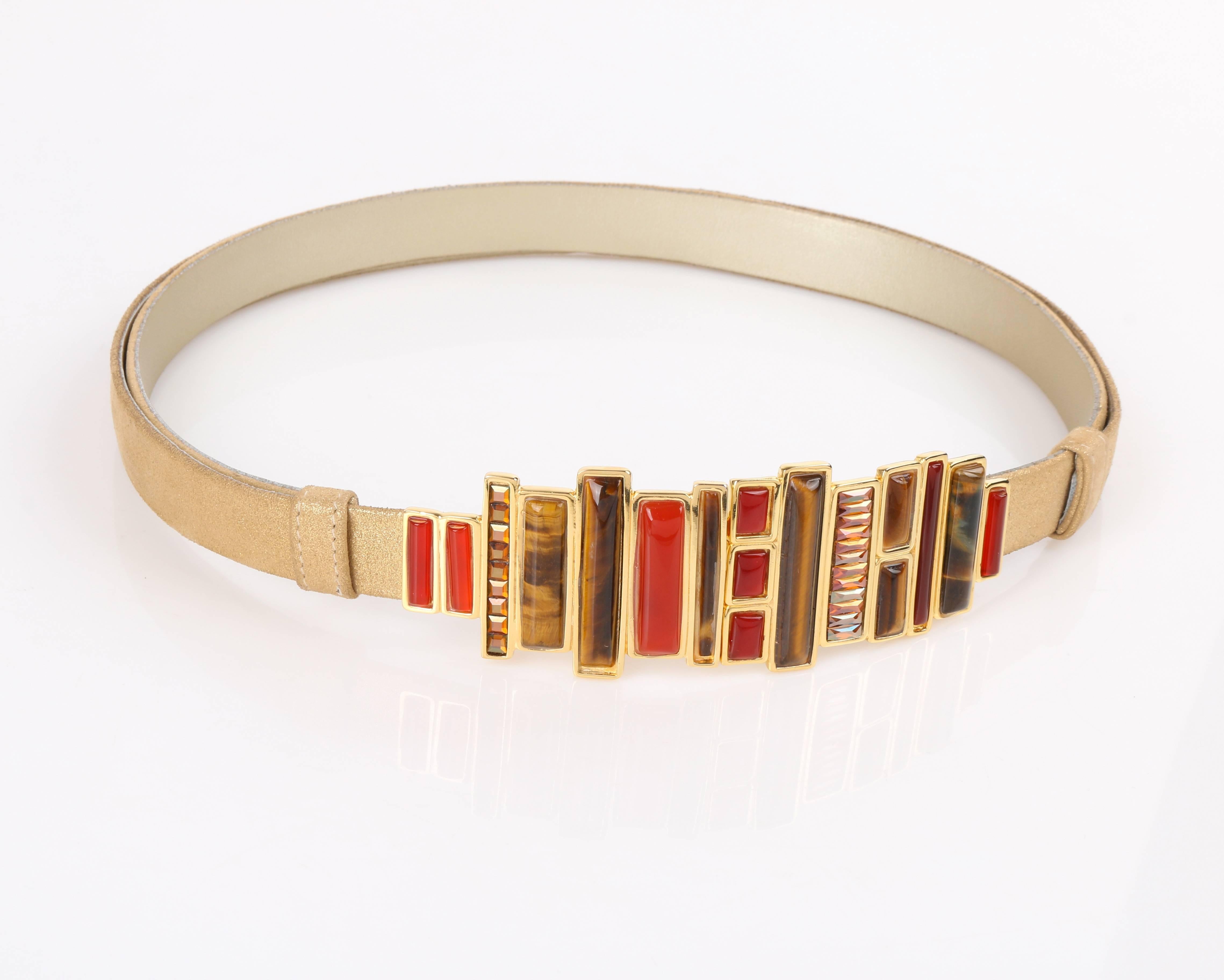 Vintage Judith Leiber c.1980's metallic gold sueded leather statement waist belt. Metallic gold glitter over top sueded leather adjustable sliding body. Varying sized oblong cabochons and rhinestones in shades of red, amber, and brown tortoiseshell