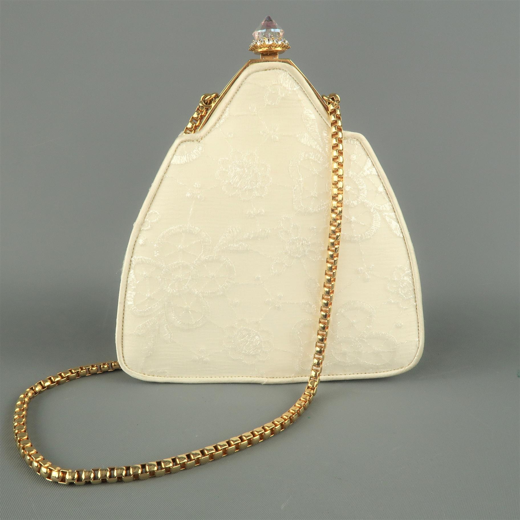 Vintage JUDITH LEIBER evening bag comes in cream lace textured silk with a gold tone hinge closure with aurora borealis crystal, gold tone chain, and satin liner. Includes mini mirror and coin purse.
 
Excellent Pre-Owned Condition.
 
Measurements:
