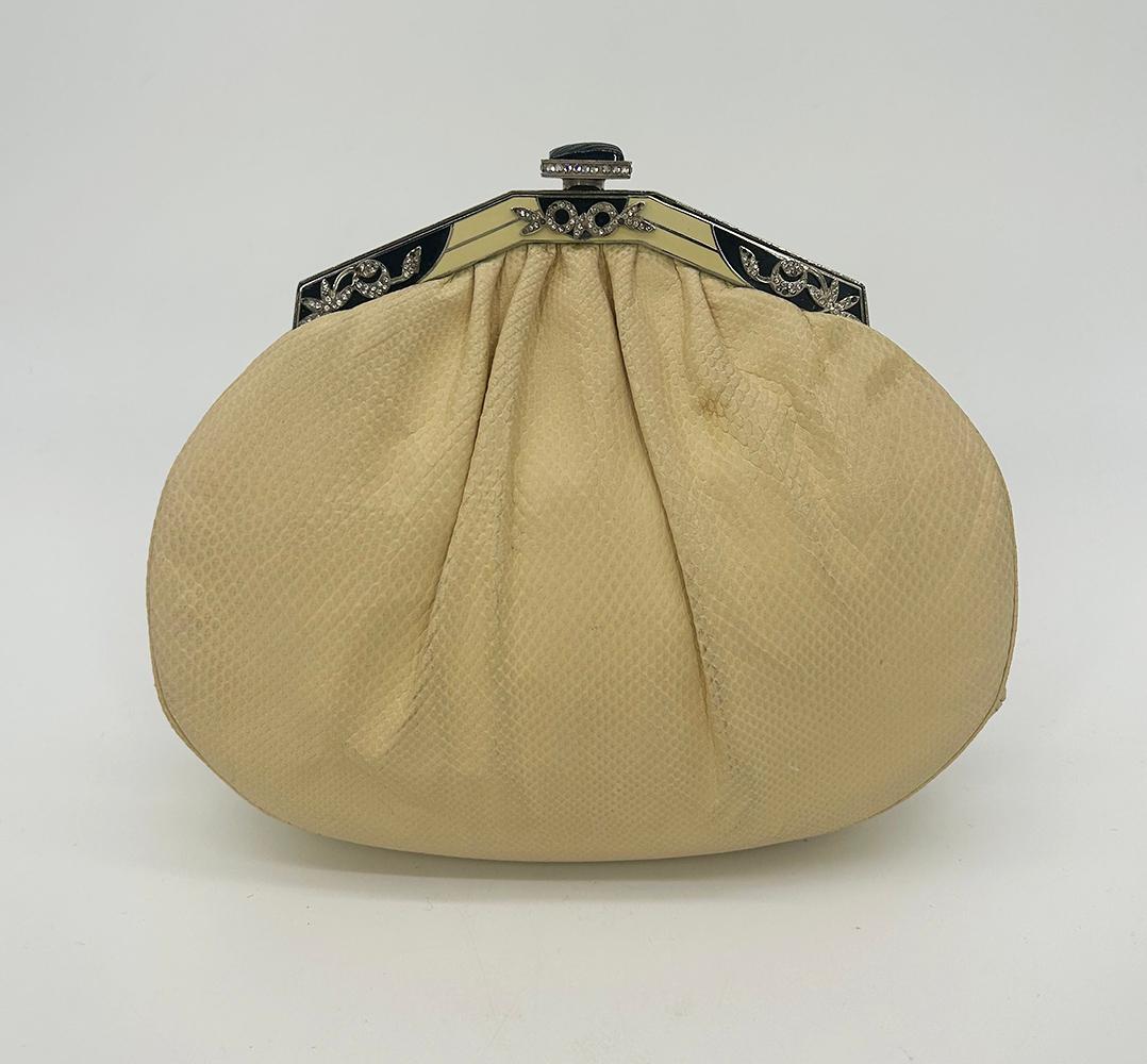 Judith Leiber Cream Matte Lizard Clutch with Enamel Crystal Top in good condition. Cream lizard leather in unique matte style trimmed with silver hardware and black and cream enamel top with tiny crystals. Top button closure opens to a cream satin