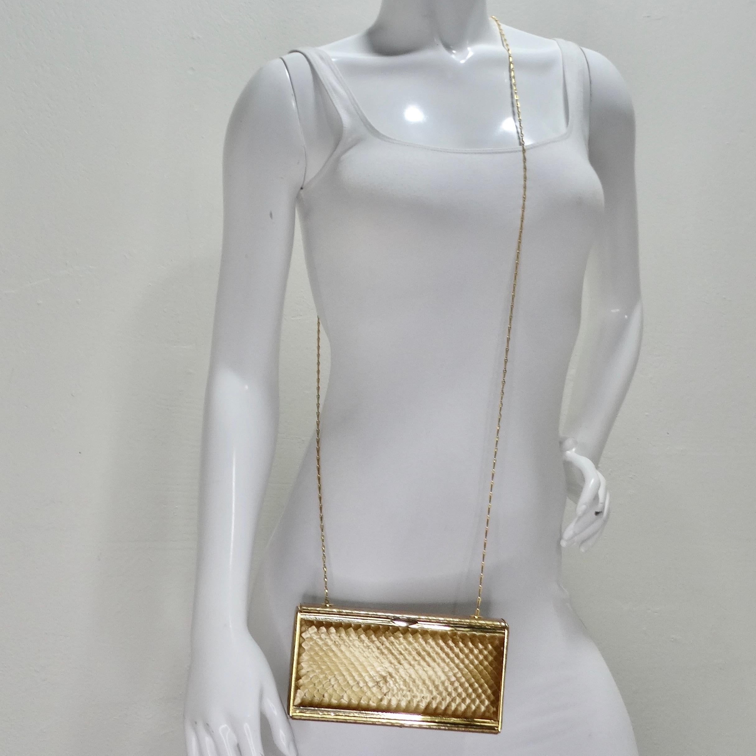Elevate your accessory game with the sheer elegance of the Judith Leiber Crossbody Gold Tone Clutch - a timeless masterpiece of luxury and style. This adorable rectangle clutch is more than just a fashion accessory; it's a statement of opulence.