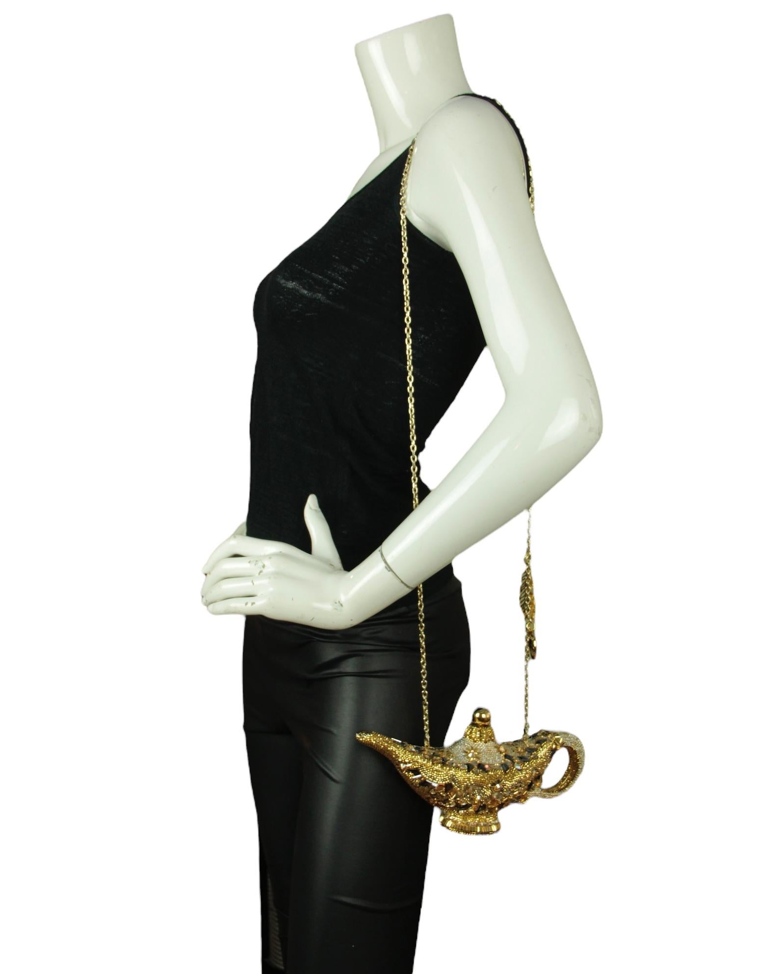 Judith Leiber Crystal Genie Lamp Minaudiere Clutch Bag. Features detachable chain strap

Hardware: Goldtone
Materials: Crystals, metal
Lining: Gold leather 
Closure/Opening: Frame closure
Exterior Pockets: None
Interior Pockets: None
Exterior