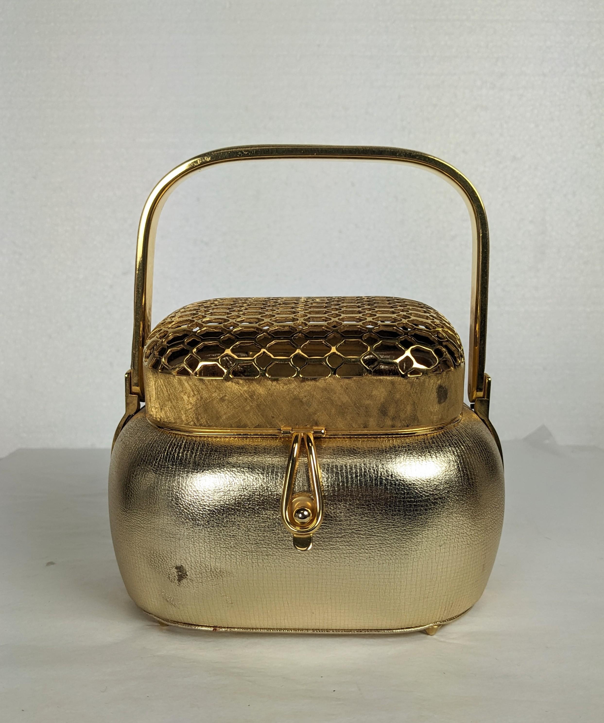 Charming Judith Leiber Gold Kid Asian style purse from the 1980's. Designed as an incense pot or hand warmer in gilt metal with gold leather body and trim. Retailed by Saks Fifth Ave. 1980's USA. 