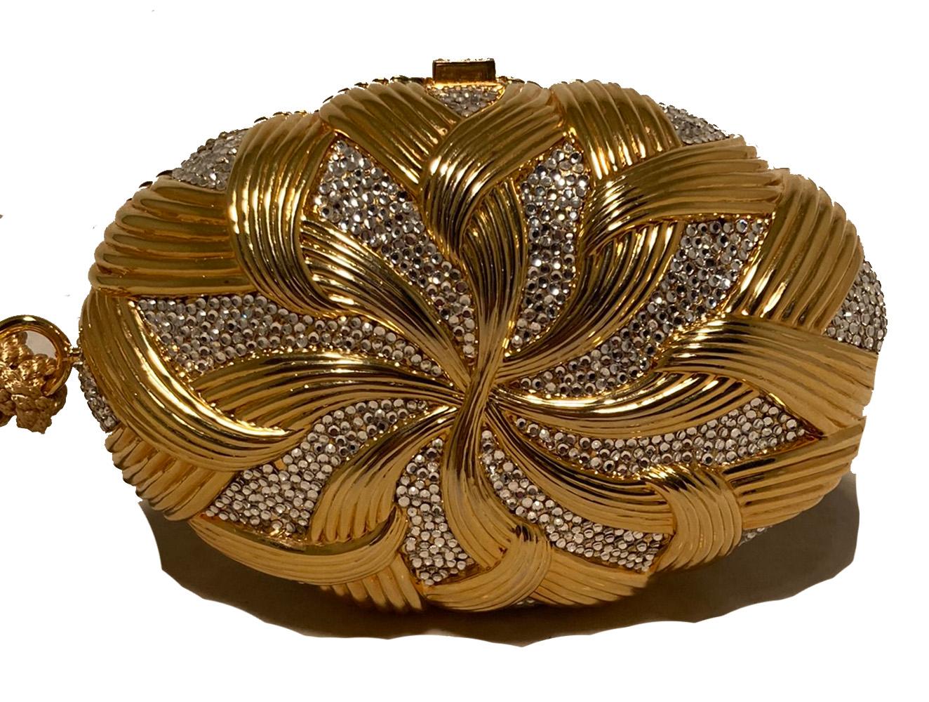 Judith Leiber Gold Basket Weave Oval Minaudiere in excellent condition. Gold basket weave design in an oval shape with clear Swarovski crystals throughout. Button closure opens to a gold leather interior with attached gold chain shoulder strap. Gold