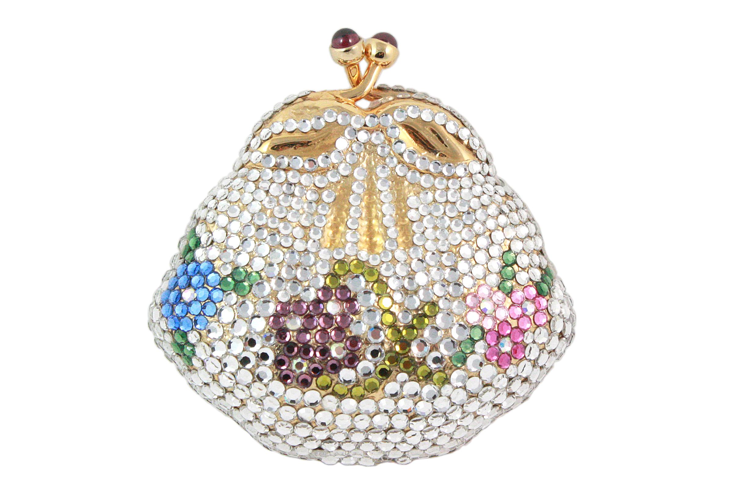 Judith Leiber coin purse
Multi-colored rhinestones in a floral design 
Gold with purple gem snap closure 
Goldtone interior 
Comes with blue dust-bag 