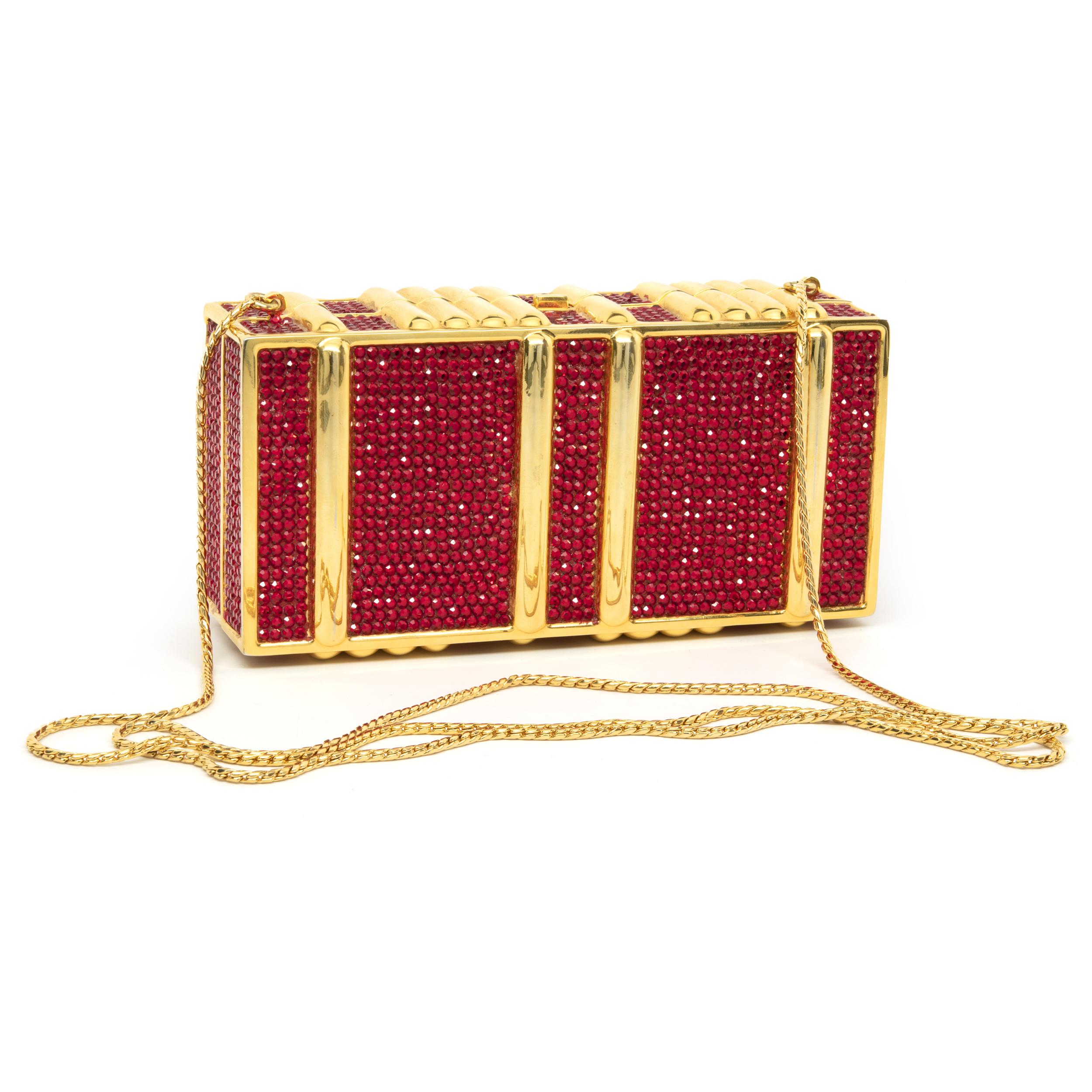 Designer: Judith Leiber
Material: gold tone steel / red crystal
Weight:  443.69 grams
Dimensions: purse measures 5.75” X 2.5”