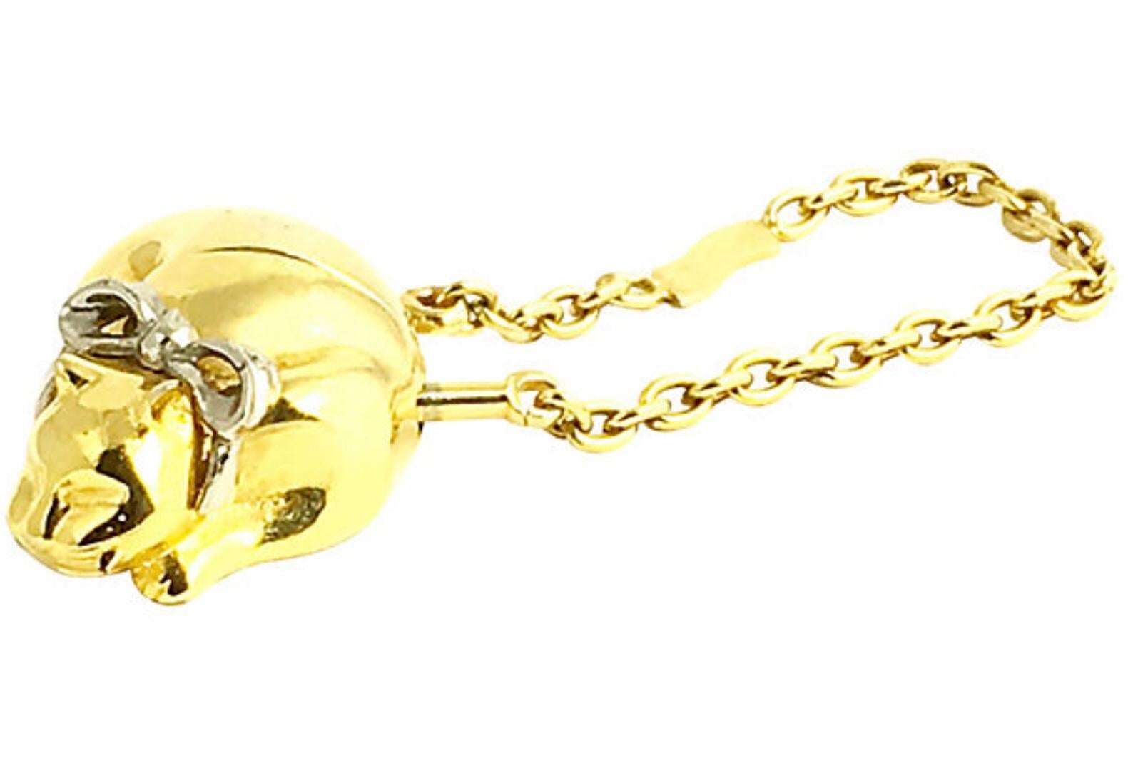Judith Leiber goldtone metal cat keychain with a silvertone ribbon. Marked: Judith Leiber. Chain: 4.75