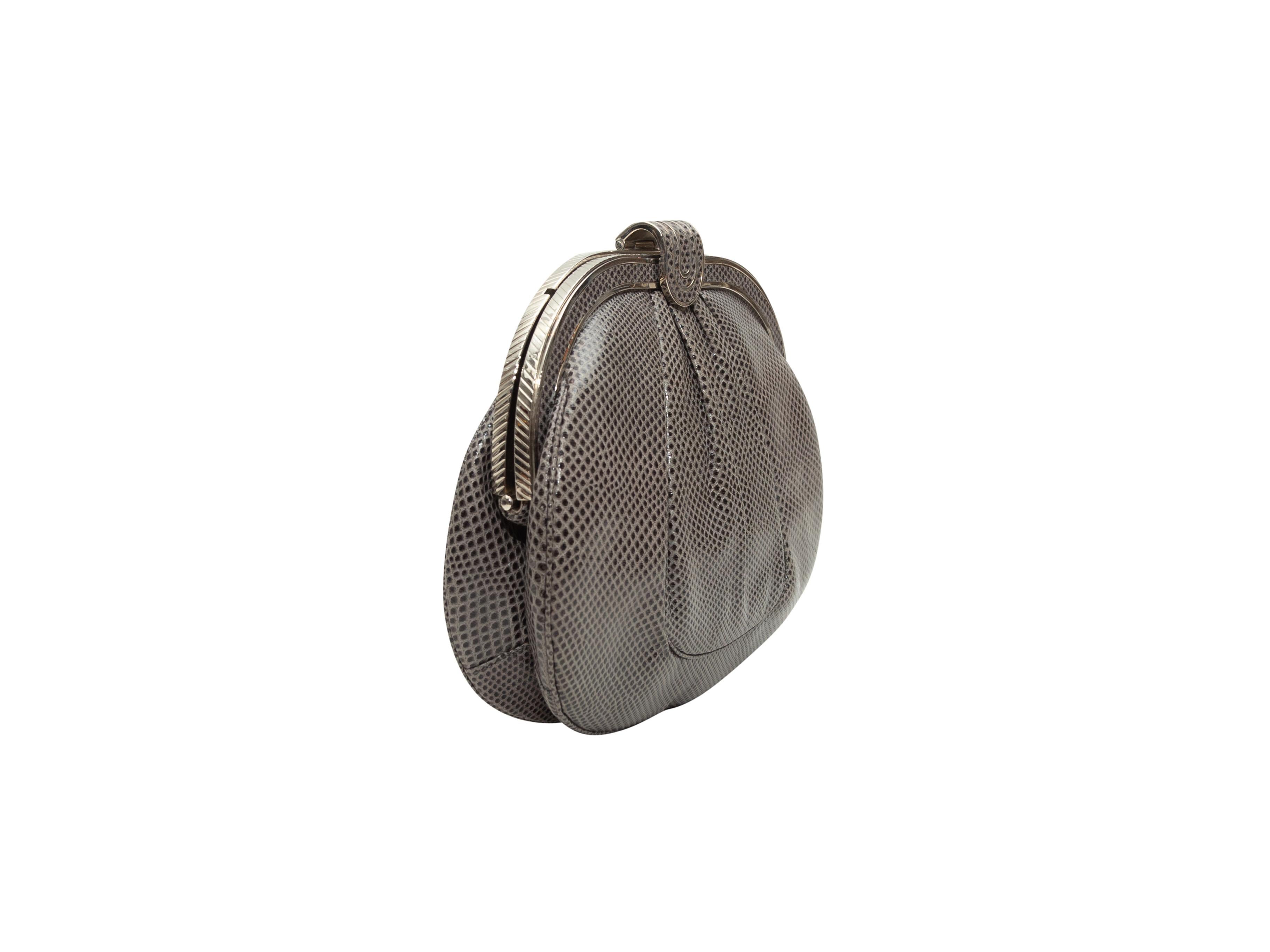 Product Details: Vintage Grey Judith Leiber Karung Clutch. This clutch features a karung skin body, silver-tone hardware, tonal satin interior, optional chain-link shoulder strap, and a top clasp closure. 7