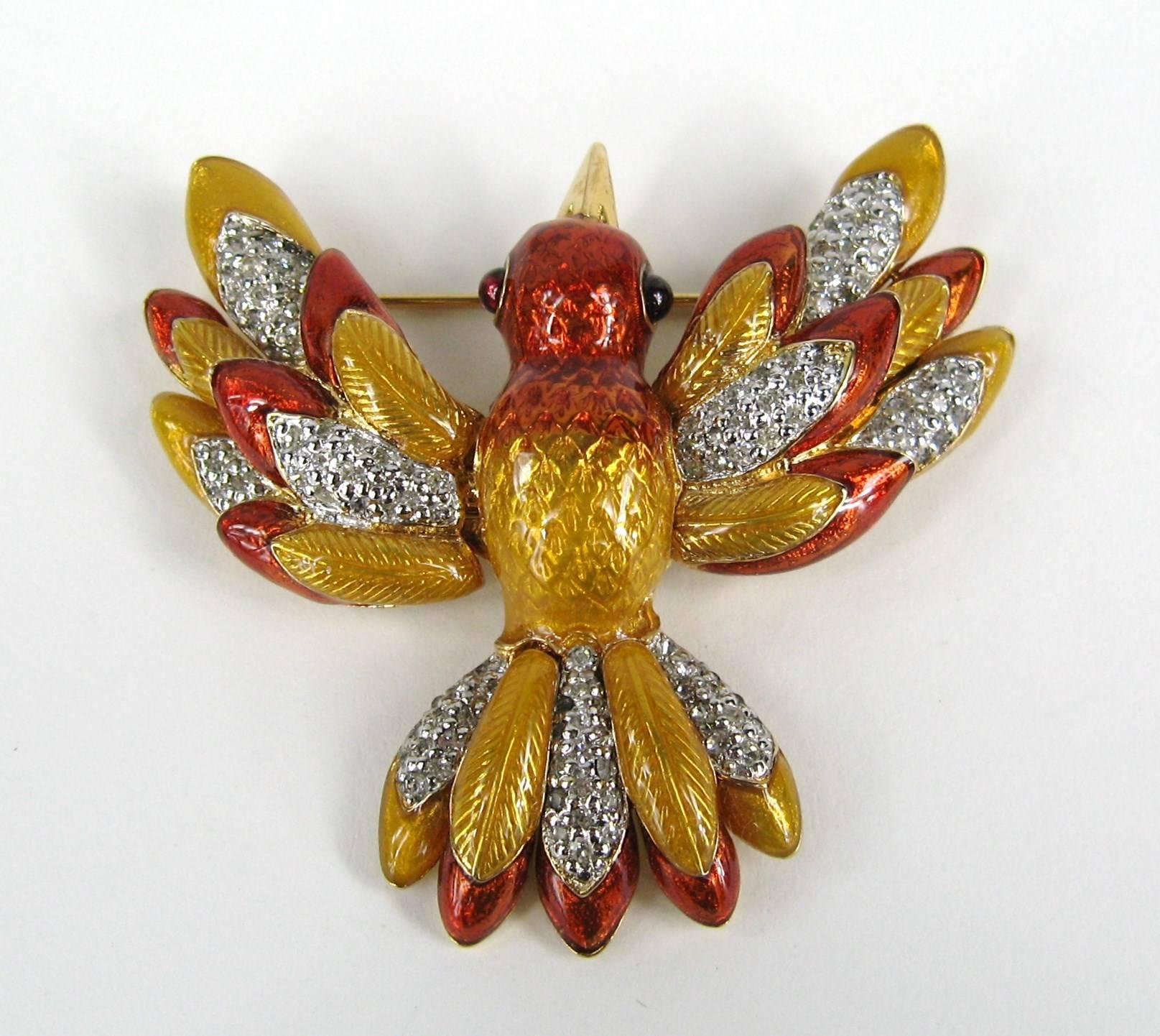 24K gold plated Judith Leiber Hummingbird brooch in the original box. This glorious bird has riveted construction and has wonderful visual depth. The bird's wings are textured to emulate the feathers. The wings are a wonderful combination of copper