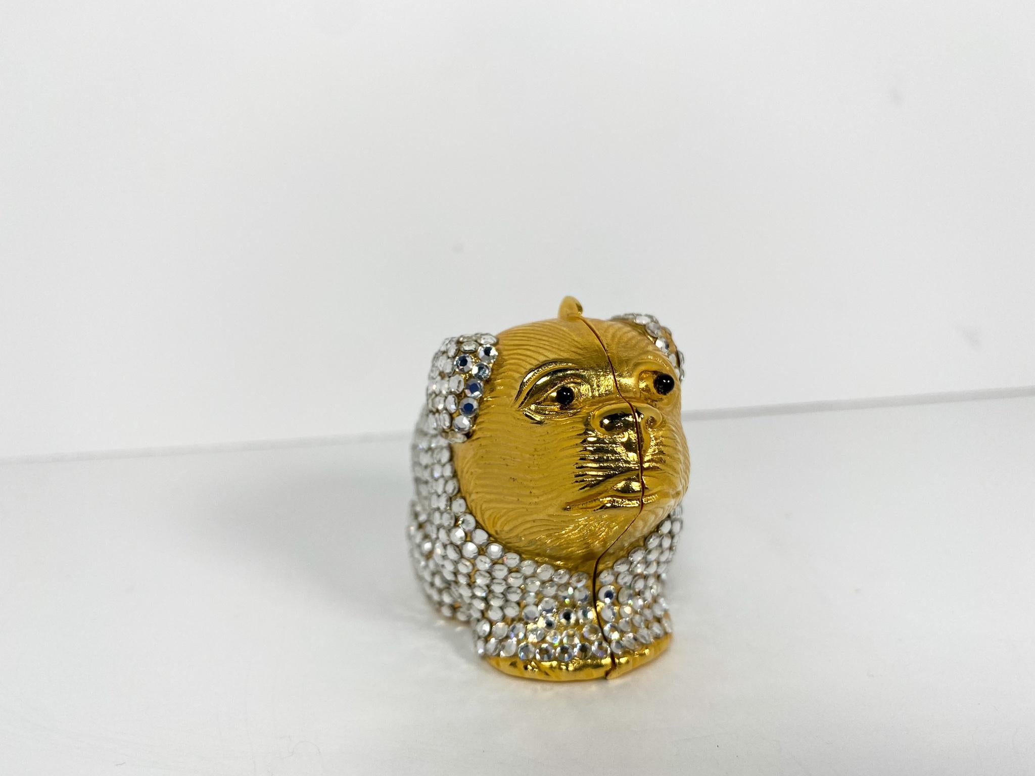 The sweetest accessory to have in your bag, gold-tone metal body in the shape of a bulldog covered in Swarovski crystals. 
		
Condition: Good used condition.
Exterior: Some loose and missing crystals.
Interior: Hallow hardware.
Serial Number: