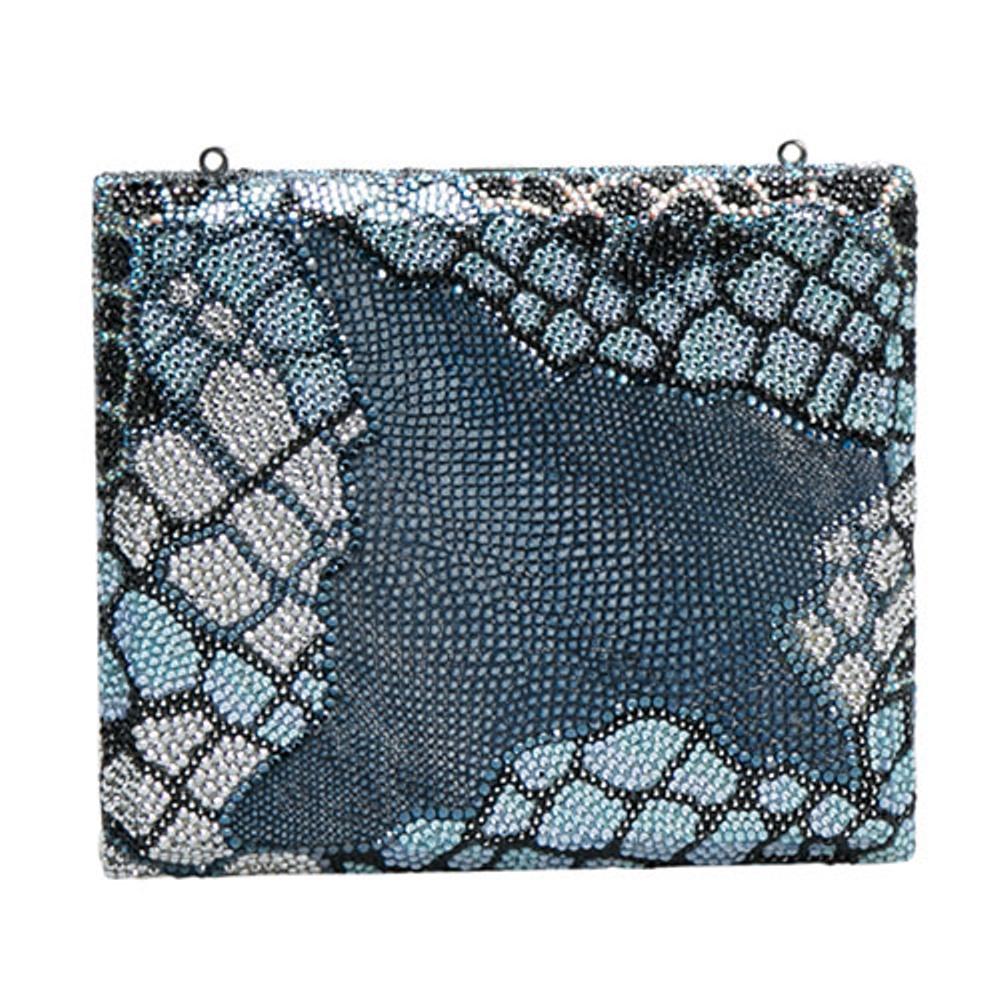 Judith Leiber has created this fashionable accessory using Swarovski crystal and textured leather. The blue box clutch opens to a leather interior that is secured by a silver-tone lock. It is like a pearl shell that opens to many wonders. Equipped